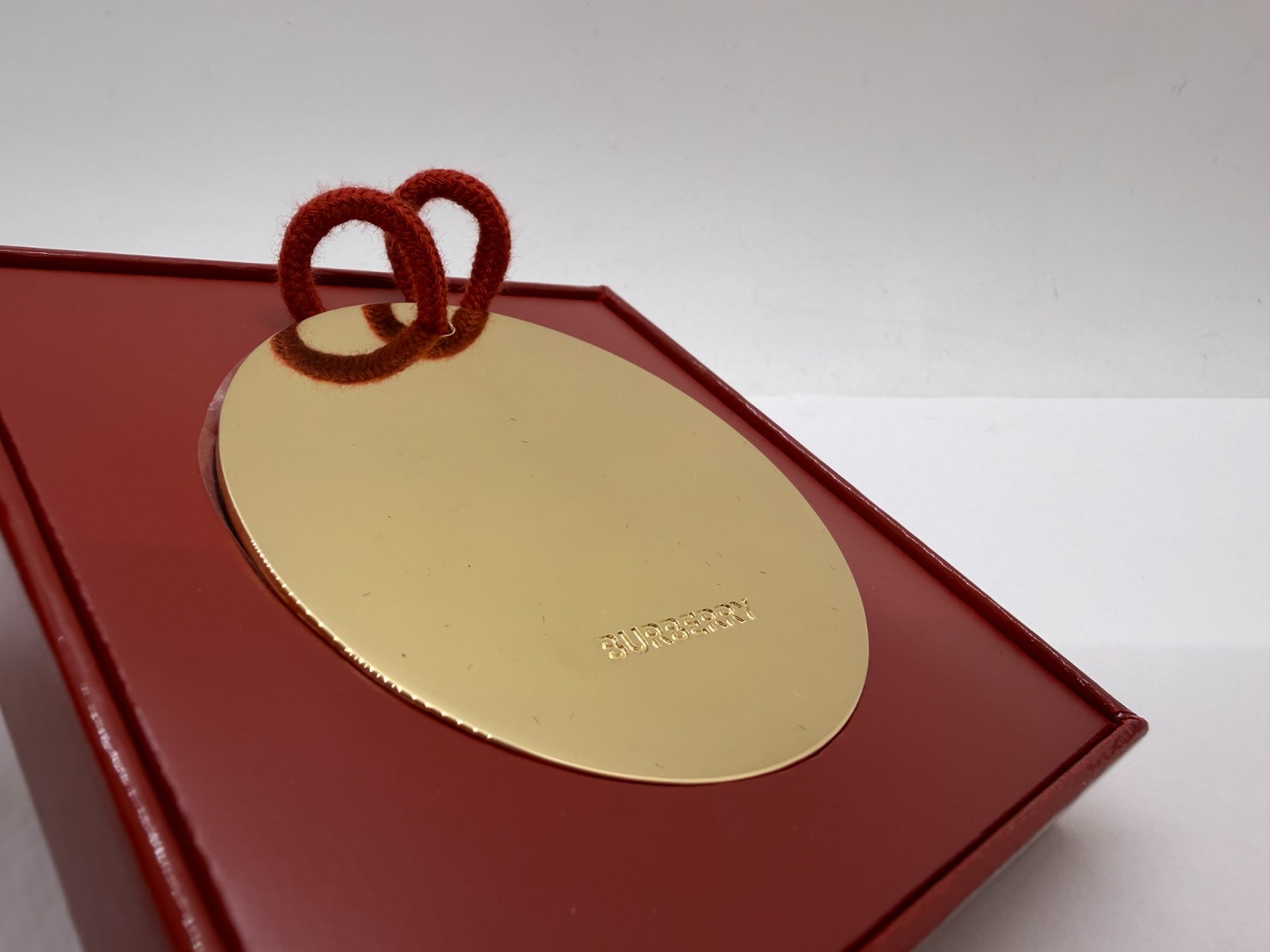 Burberry Metal Gold-Tone Round Brand Engraved Medallion Ornament Bauble