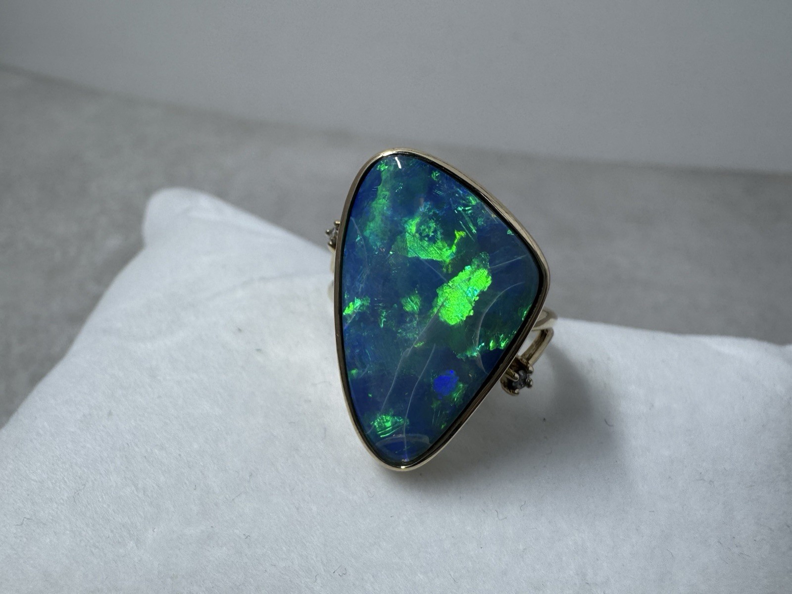 Natural Australian boulder opal with A 14k Gold ring And Diamonds. Ring size 8.