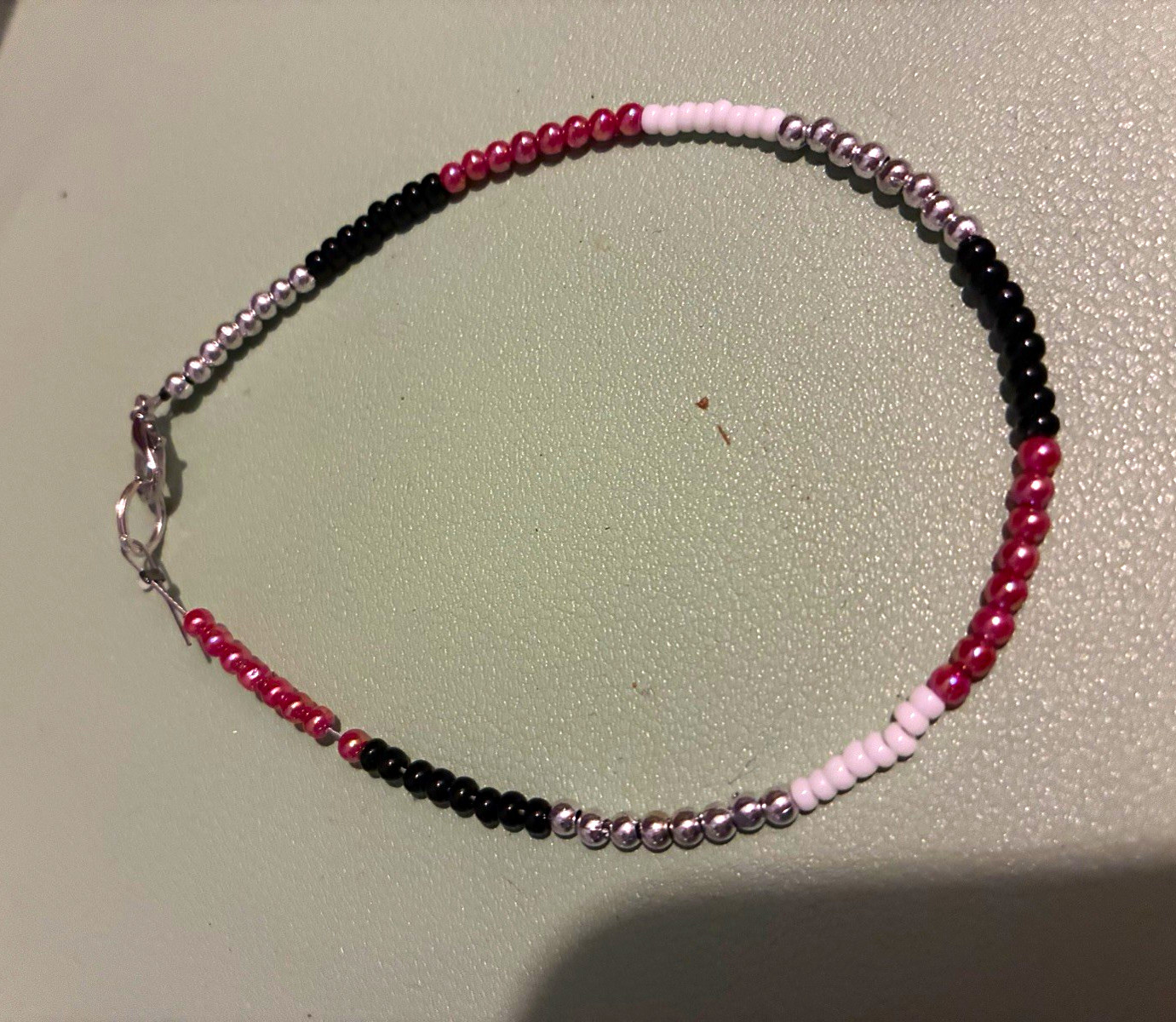 Multicolor Glass Beaded Bracelet with Lobster Clasp Closure.