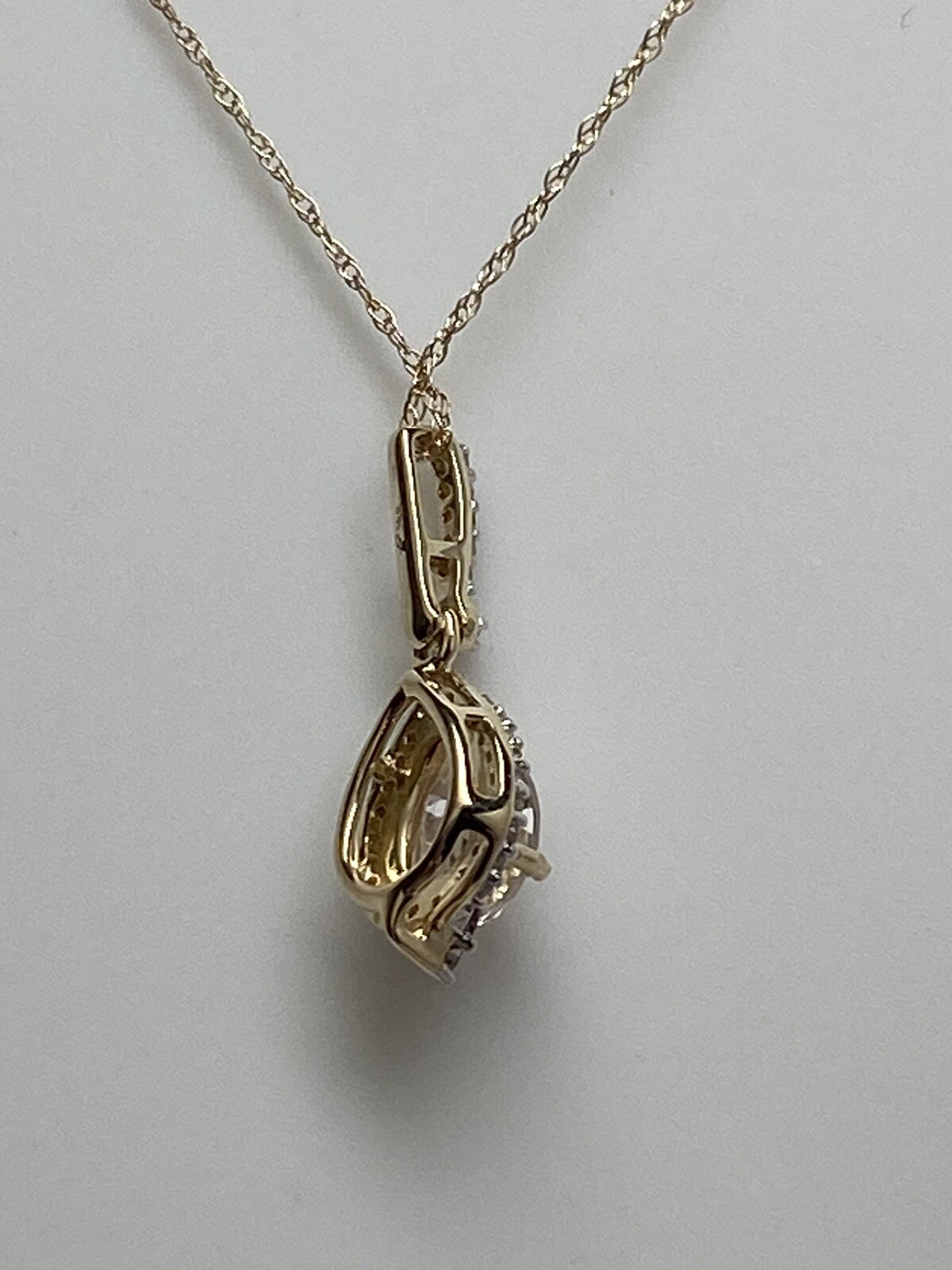10K Yellow Gold Pear Shape Morganite and 0.11ct twt. Diamond Pendant with Chain