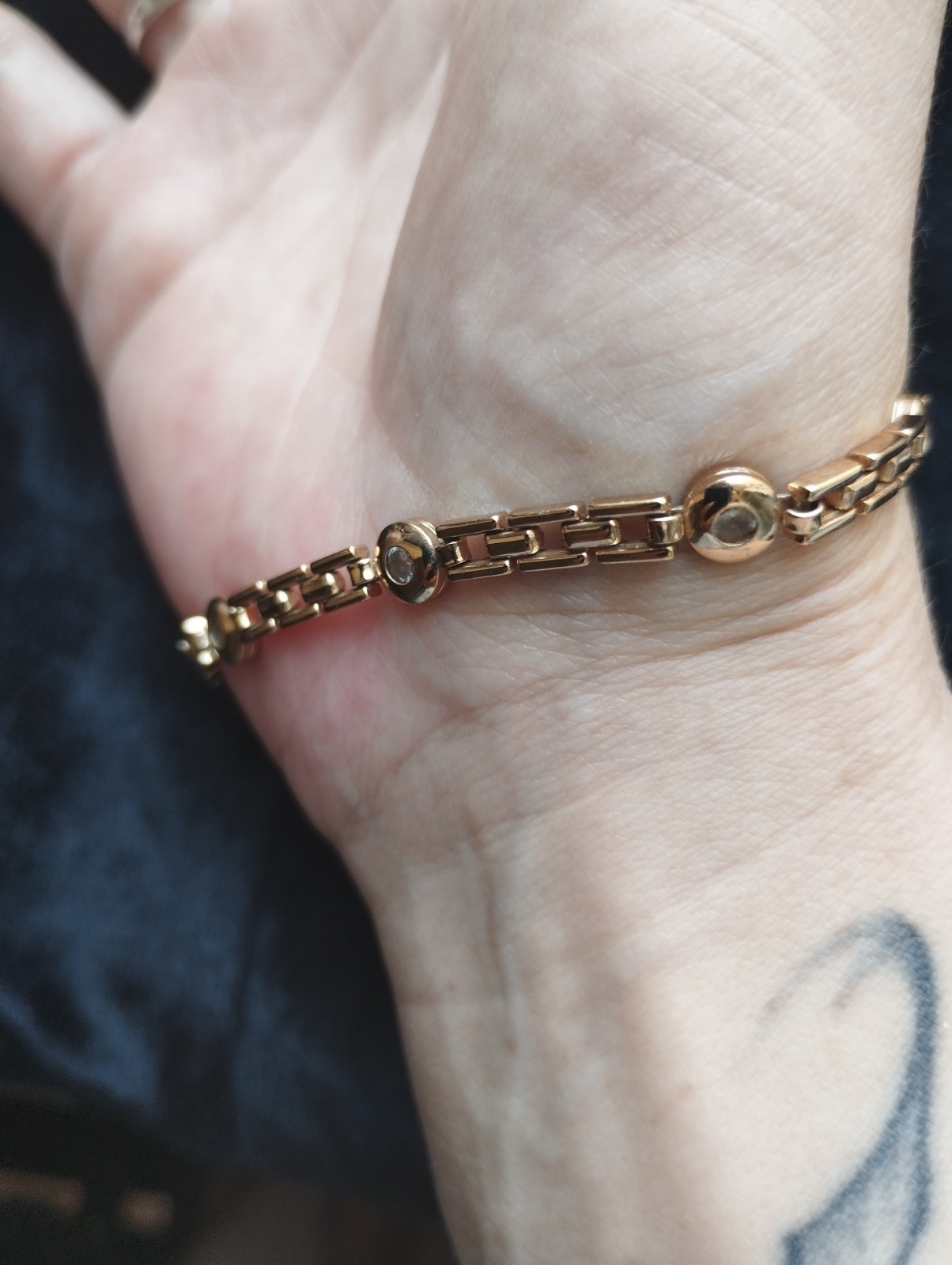 Gold-colored bracelet.