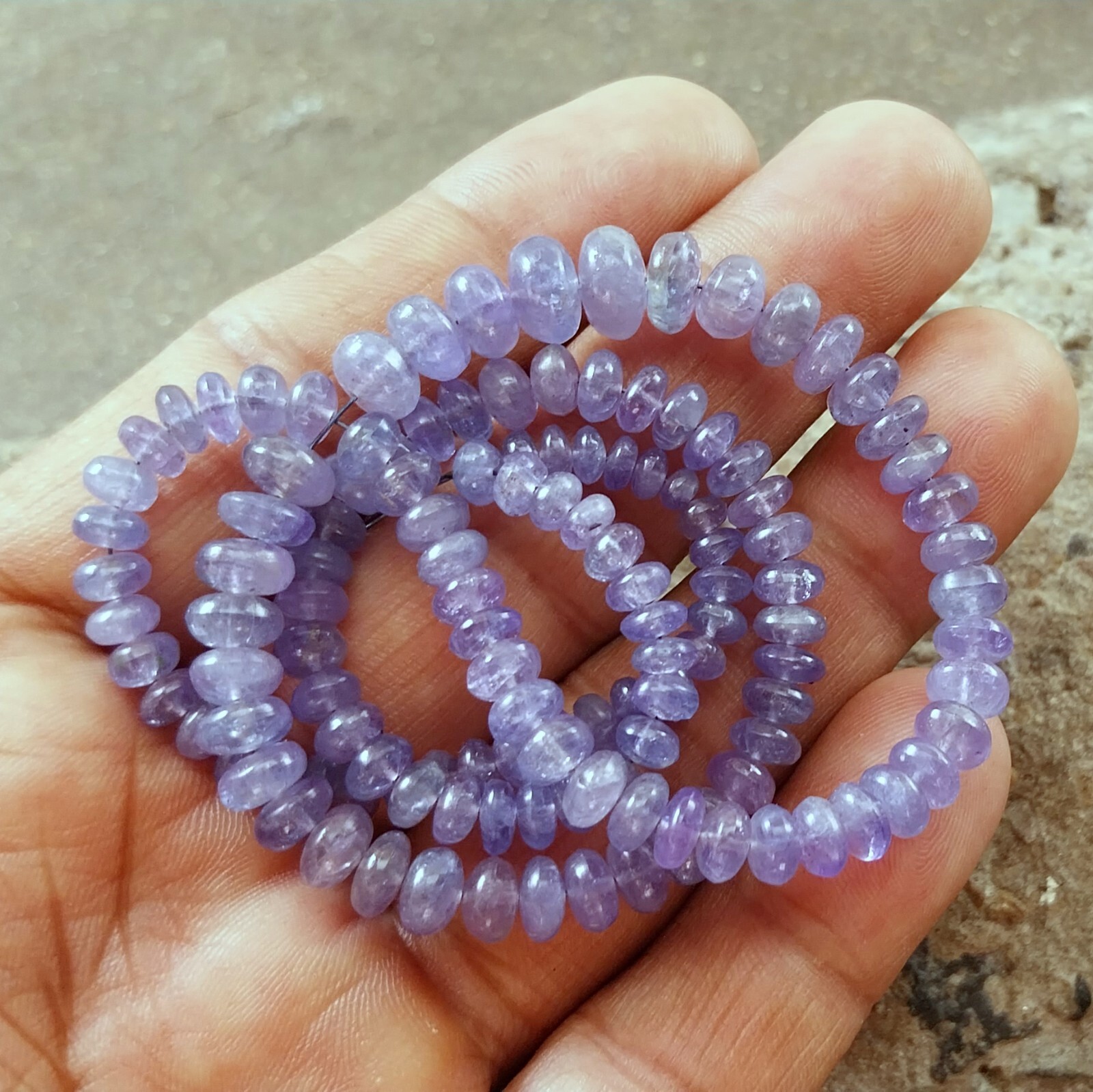 141 Carat 4.5 to 8 MM Natural Light Blue Color Smooth Tanzanite 17 Inch Beads