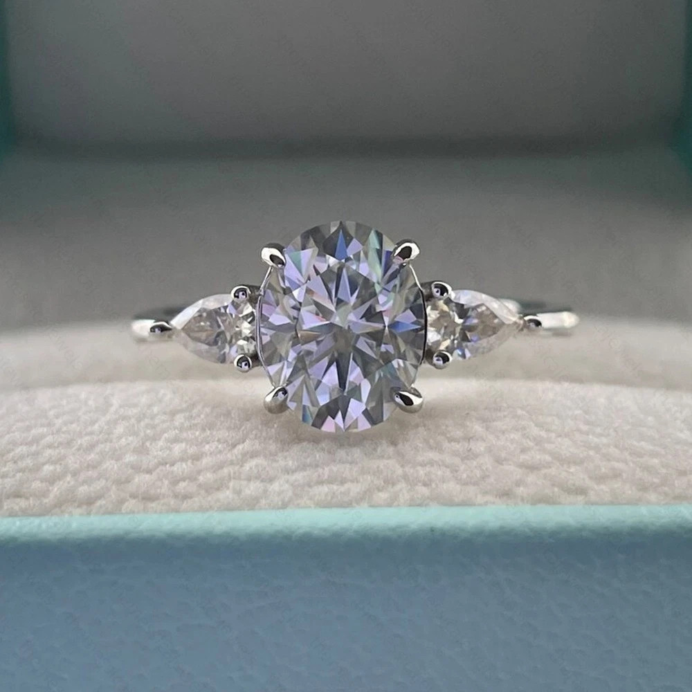 3.10 TCW Oval Cut Moissanite Three Stone Engagement Ring 14K White Gold Plated