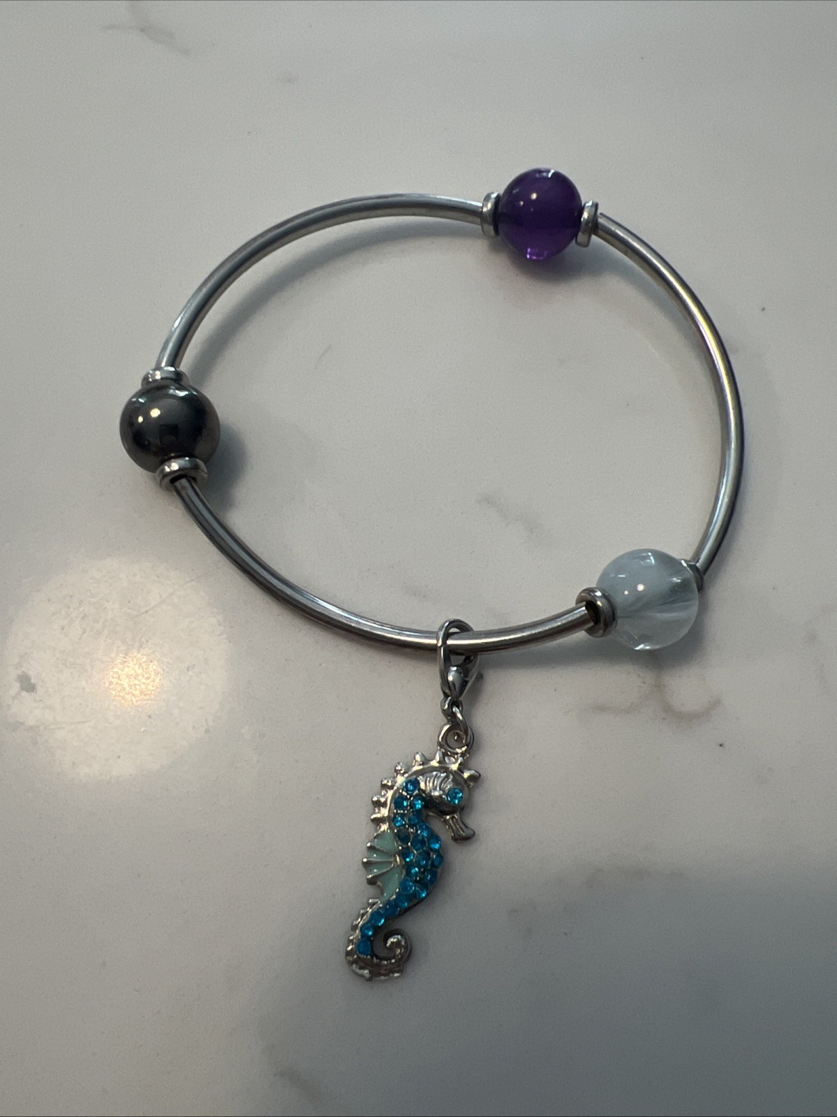 Sea Horse Charm With Liquid Silver Purple And Silver Beads Stretch Bracelet