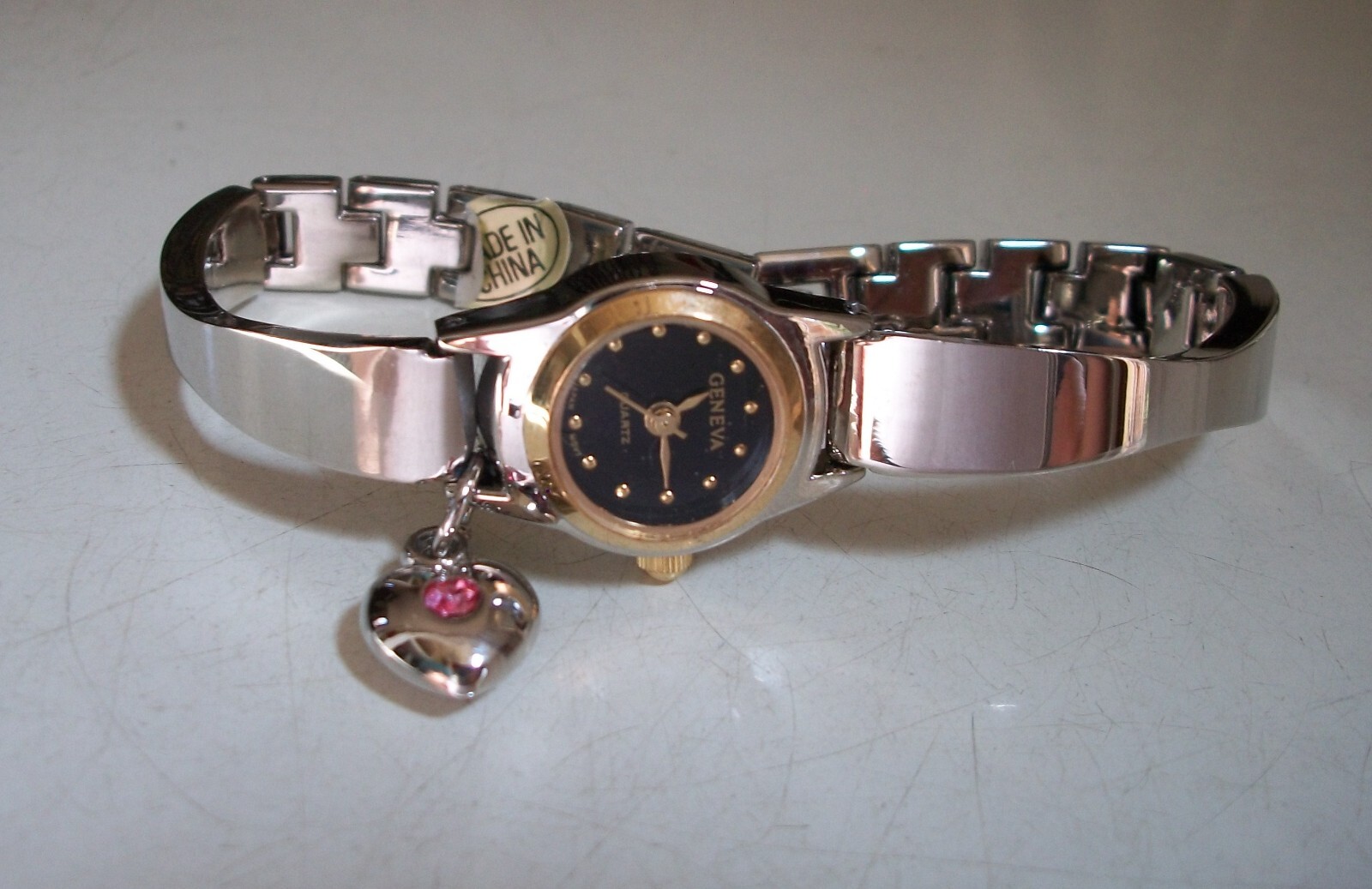 Women’s Silver Or Gold Finish Dangling Heart Color Dial Fashion Fun Watch