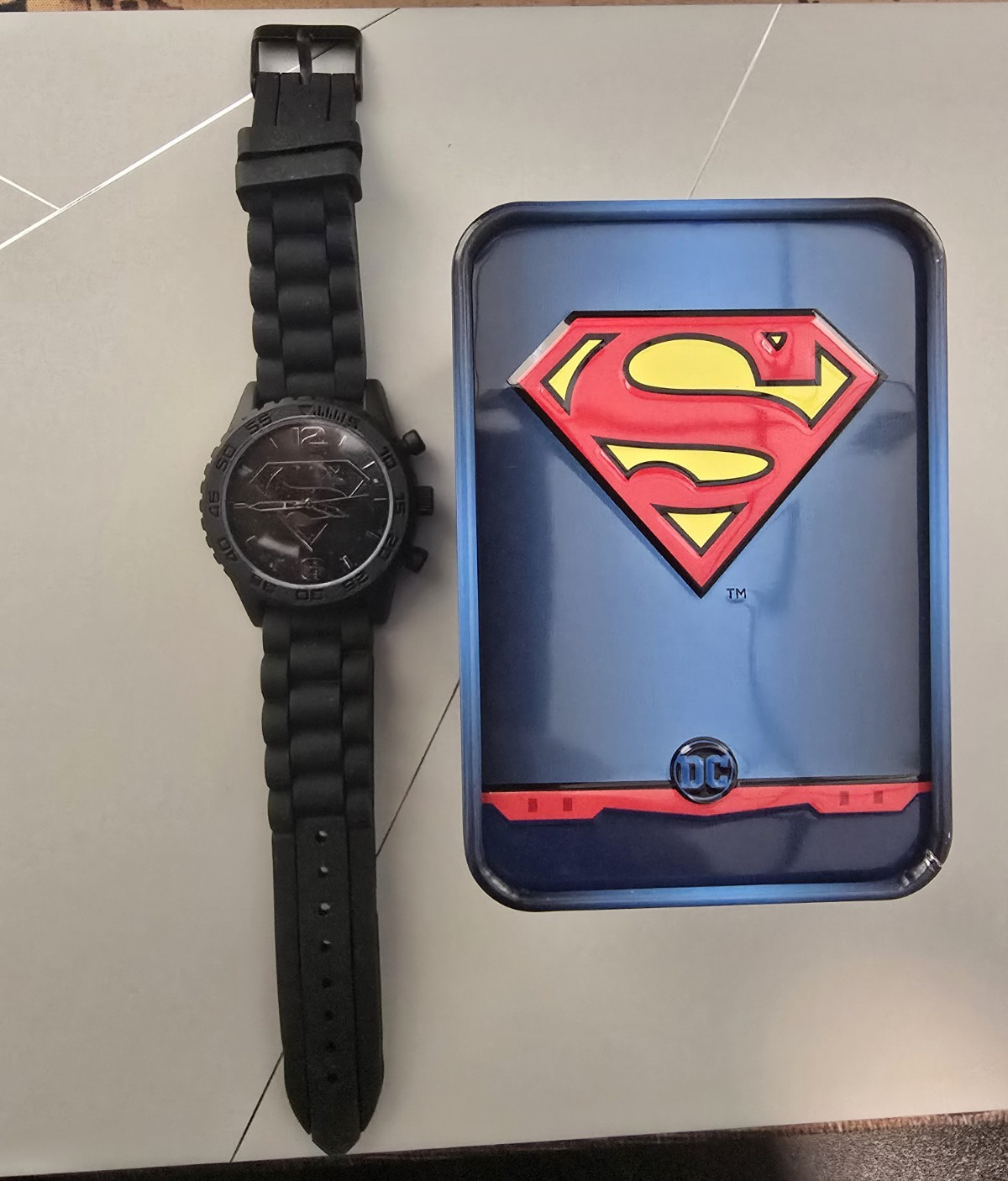 Accutime Superman Men’s Quartz Analog Black Dial Silicone Strap w/ Tin Box