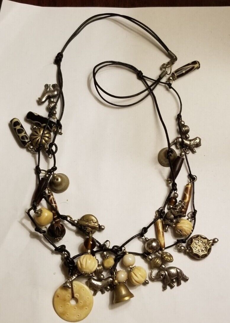 VINTAGE MOROCCAN ANIMAL CHARM NECKLACE LEATHER CORD SUSAN CUMMINGS STYLE