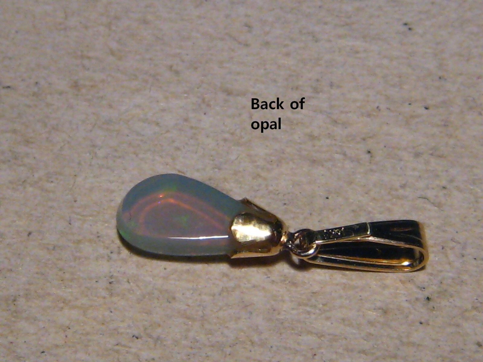 .90 ct. small Bright Opal Pendant , Solid 14 k yellow gold