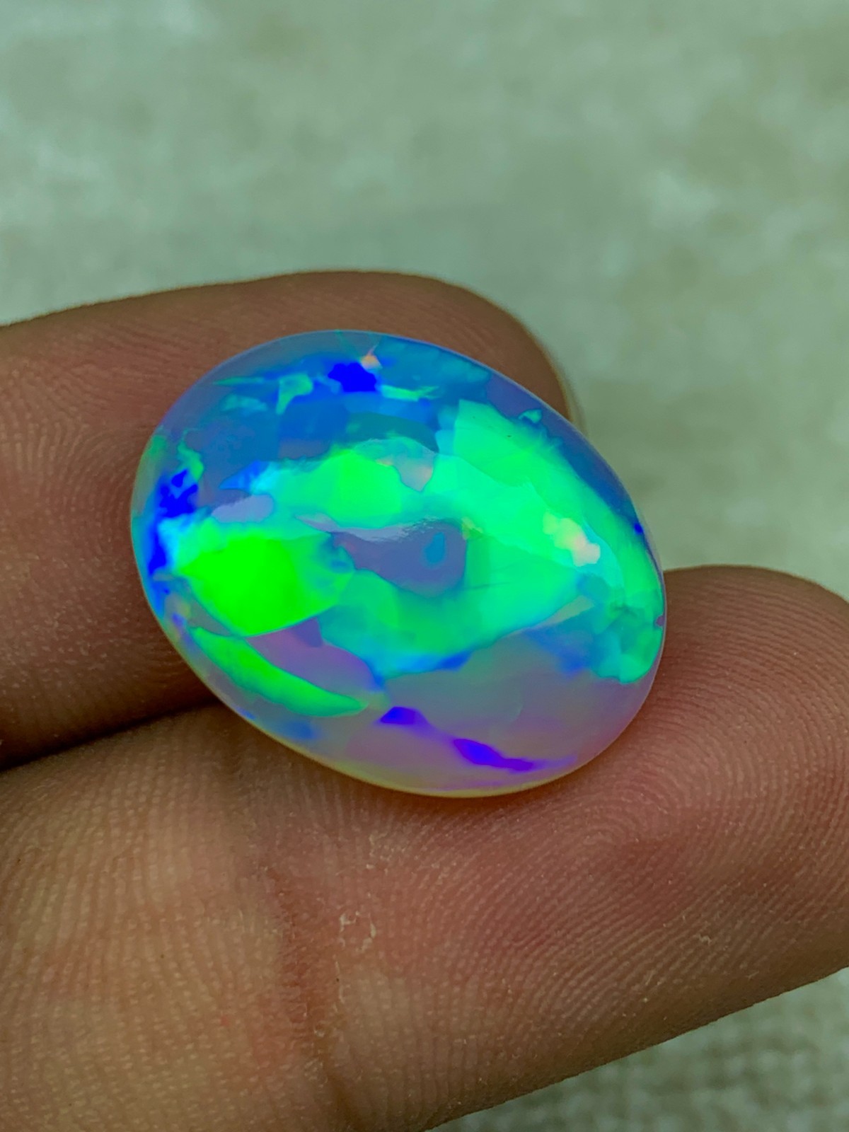 Natural Ethiopian Opal 8.30 Carat Oval Cabochon Rainbow Fire Welo Gemstone