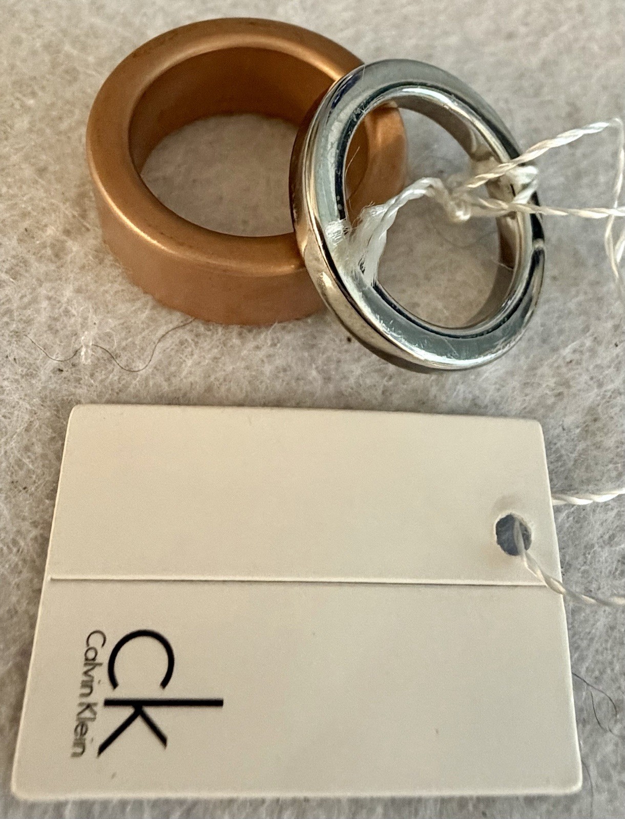 NIB Calvin Klein Two-Tone Interlocking Band Ring – Silver & Rose Gold Steel Sz 6
