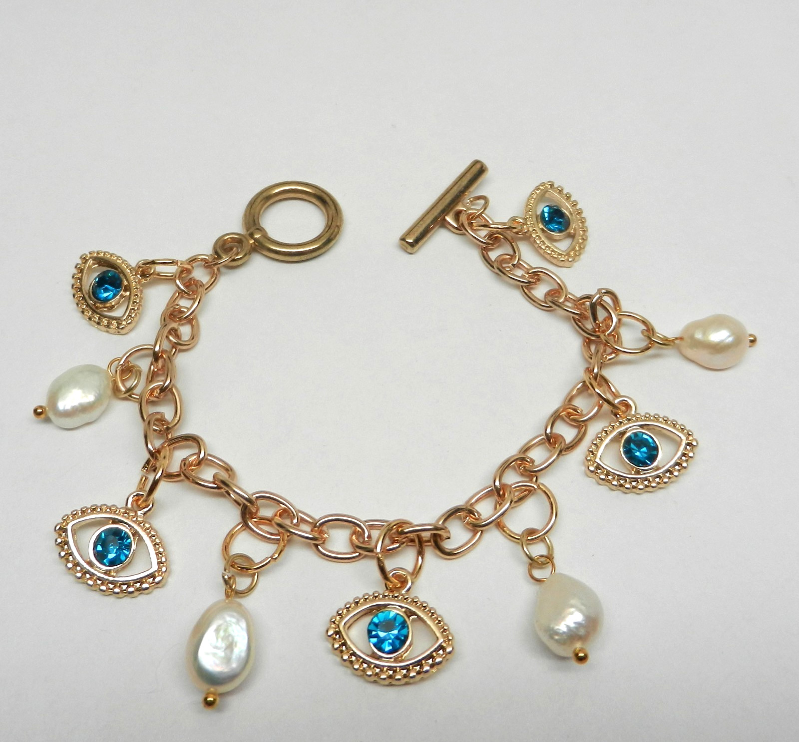 Gold-tone link charm bracelet blue evil eye talismans freshwater pearls 7″