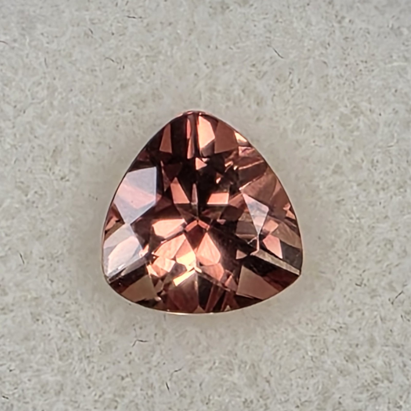 1.72 ct Oregon Sunstone –Trillion Cut – Reddish Orange Color Center Under Table