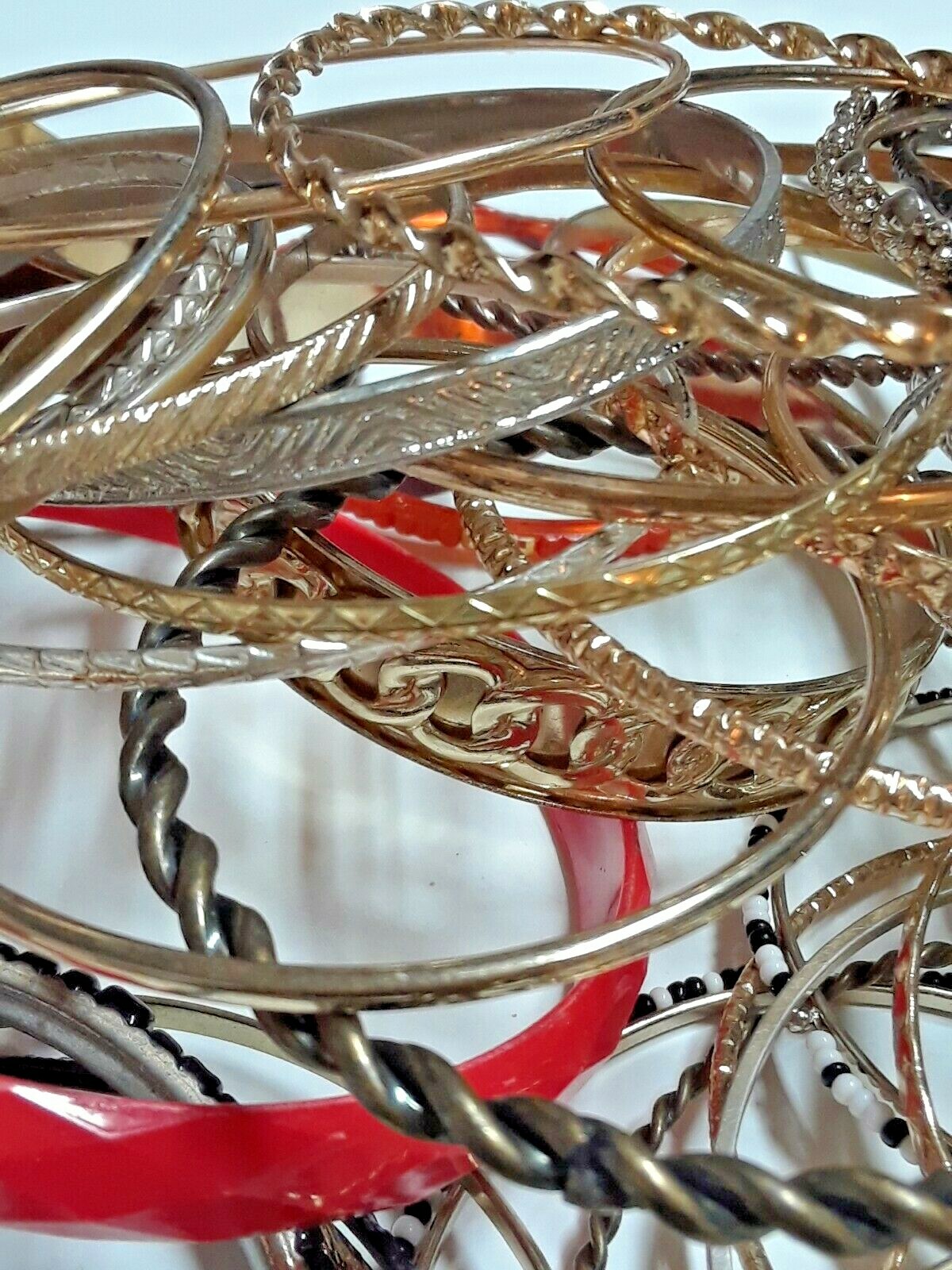 Bangle bracelets. gold tone silver tone, metal, plastic, with patterns. Lot