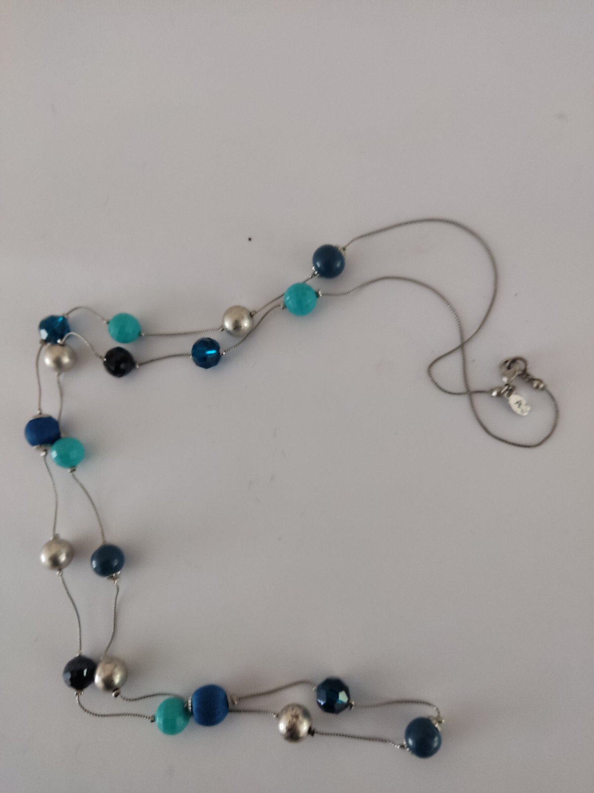 Accessorize long mixed bead blue Turquoise Navy necklace.
