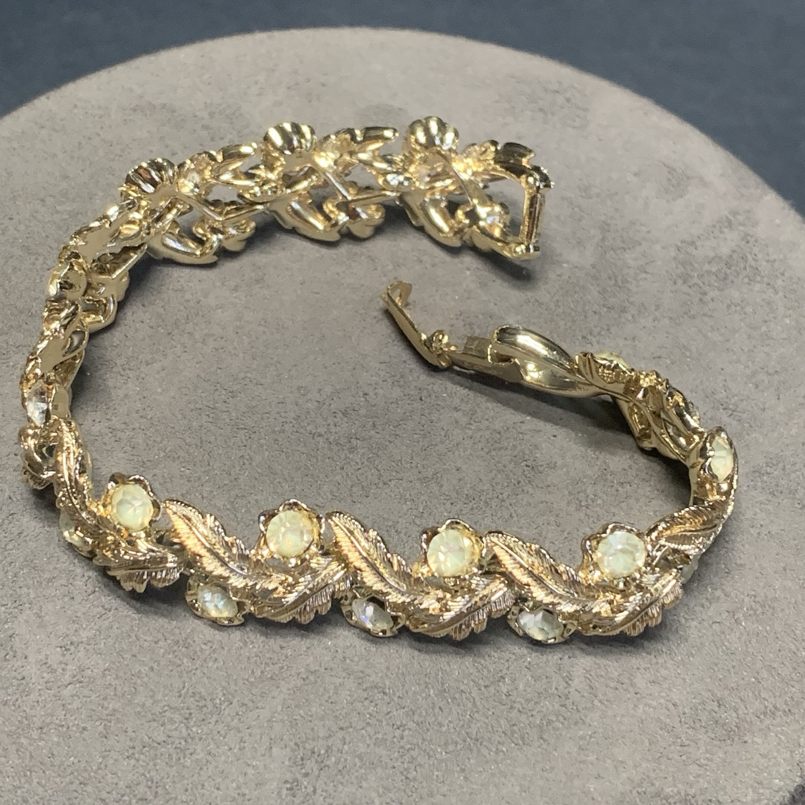 Vintage Coro 7.5” Bracelet Textured Gold Tone Leafs Rhinestones Fold Over Clasp