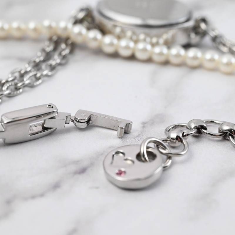 sara ladies’ wristwatch pearl bracelet watch oval shell dial heart motif silver