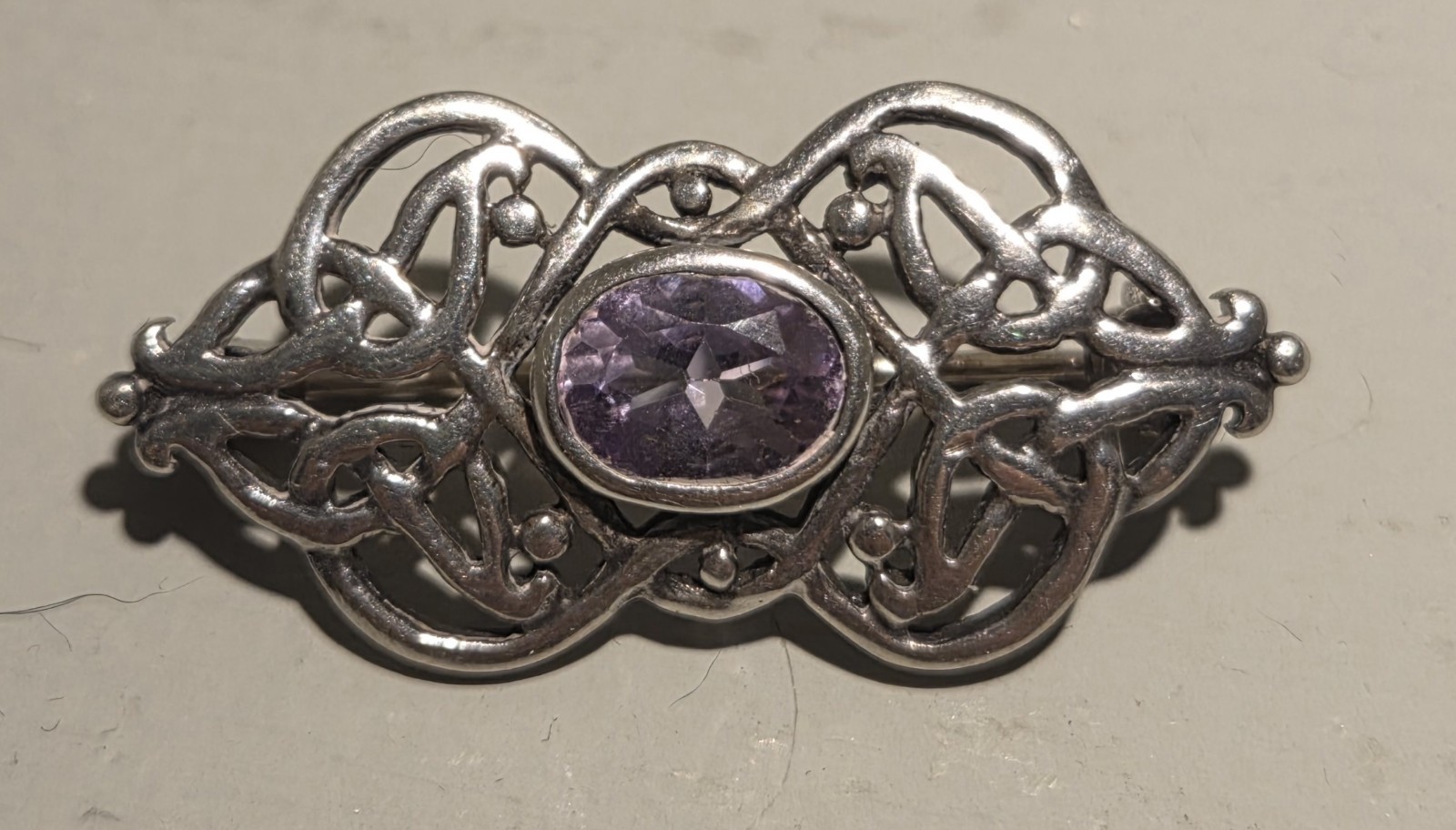 Alexander Castle 925 sterling silver brooch featuring an amethystcolored Stone