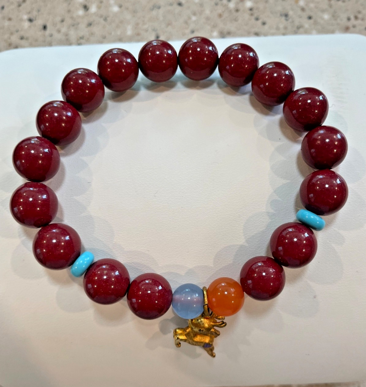 Cinnibar bracelet with deer charm (10.6mm)