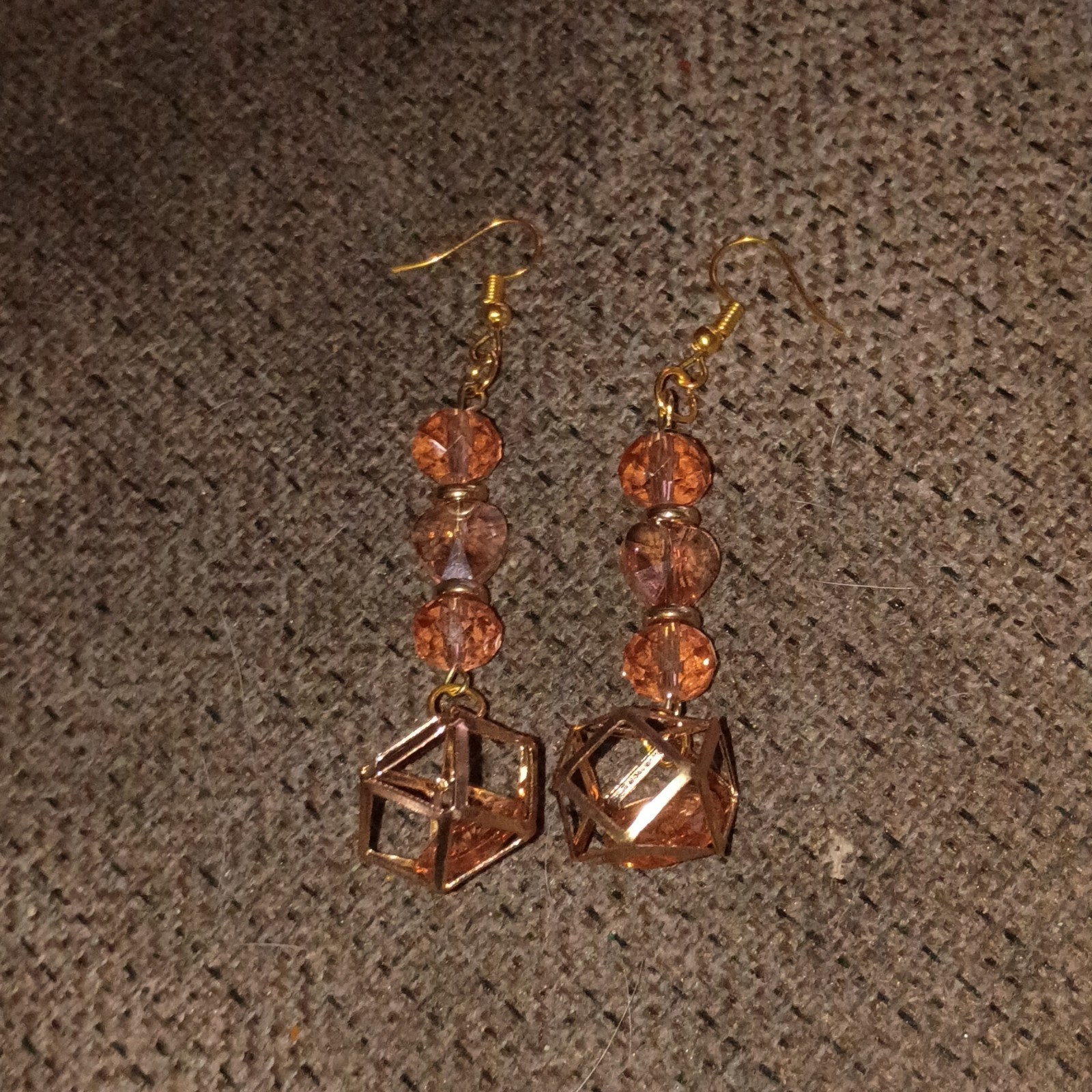 Handmade Beaded Earrings That Are Gold And Pink And Dangly