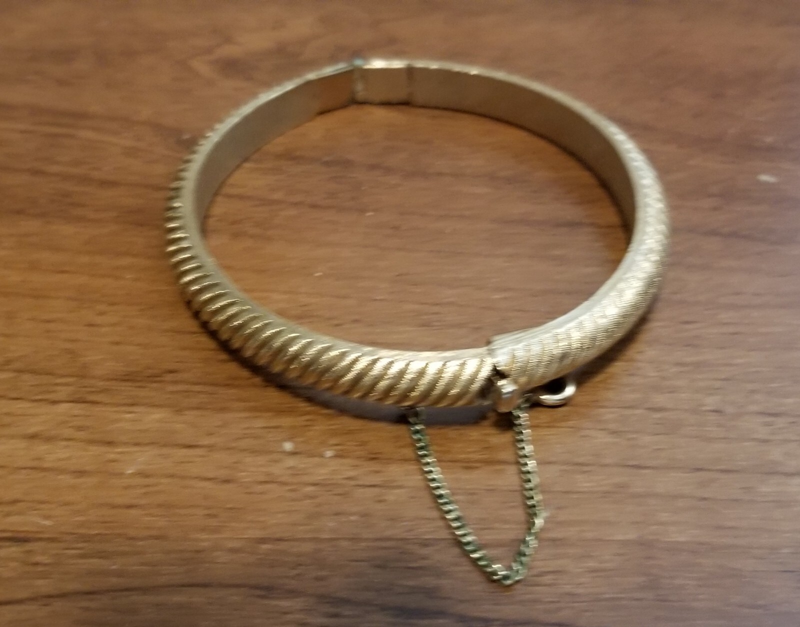 Vintage Crown Trifari Gold Hinged Bangle Bracelet With Safety Chain.