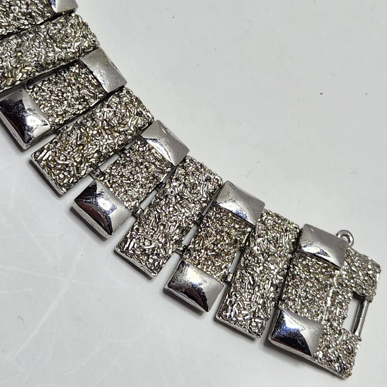 Vintage Monet Silvertone Bracelet Textured 1″ wide 7″ Fold Over Clasp No Safety