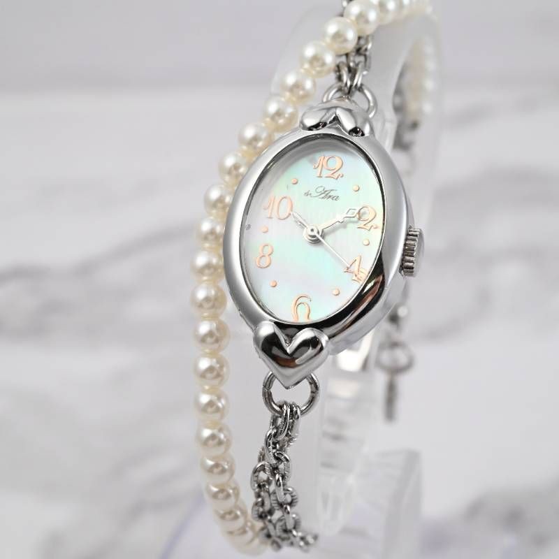 sara ladies’ wristwatch pearl bracelet watch oval shell dial heart motif silver