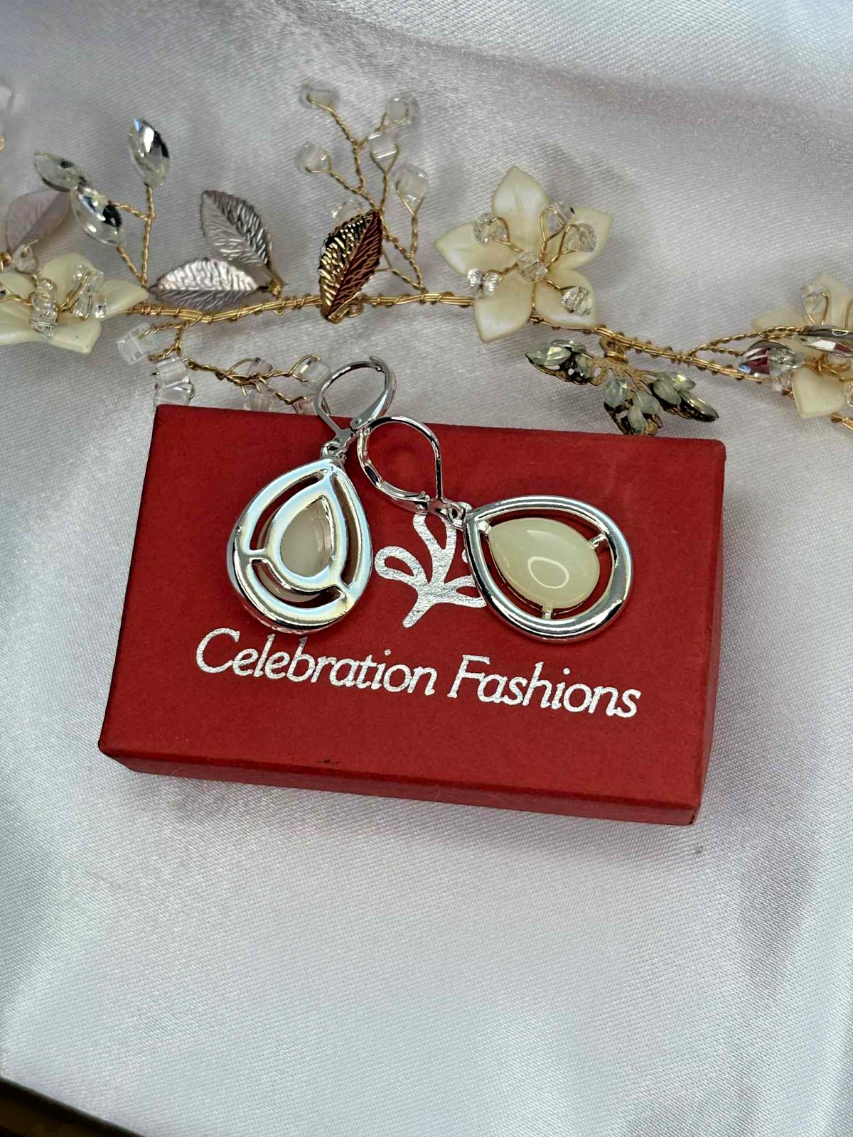 Ivy a polished ivory colored teardrop earrings. Free lead and nickel free.