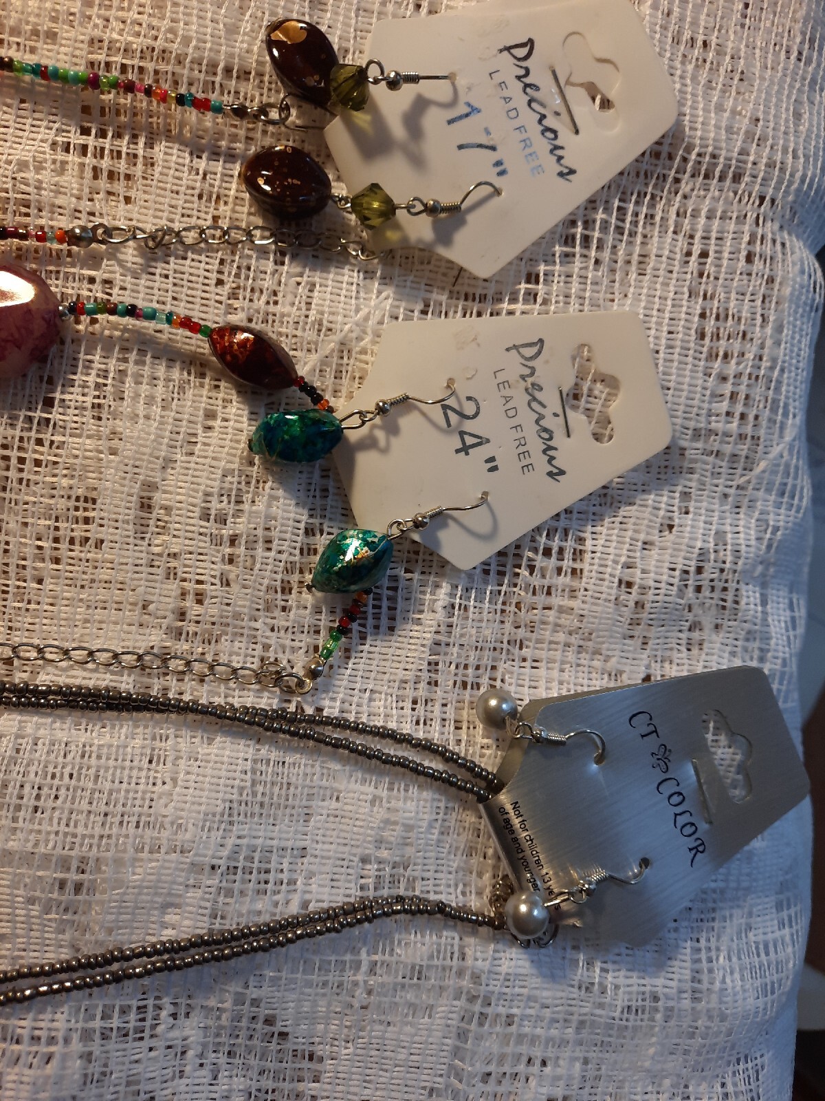 7 New In Package Necklaces,Some W/ Earrings. Pretty Sets, Unusual. Size Varies