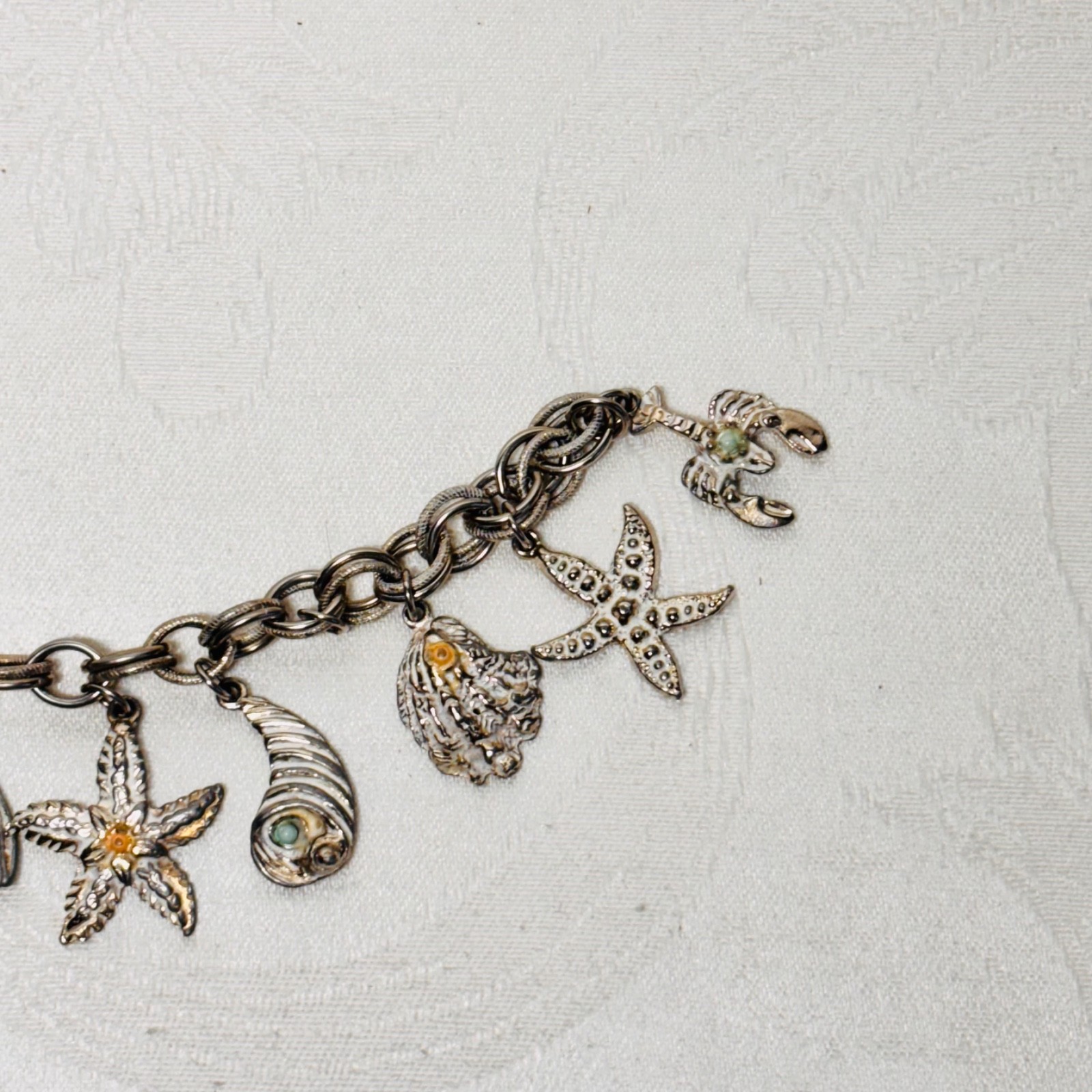 BRACELET ocean life charms starfish shells fish lobster fold over clasp vintage
