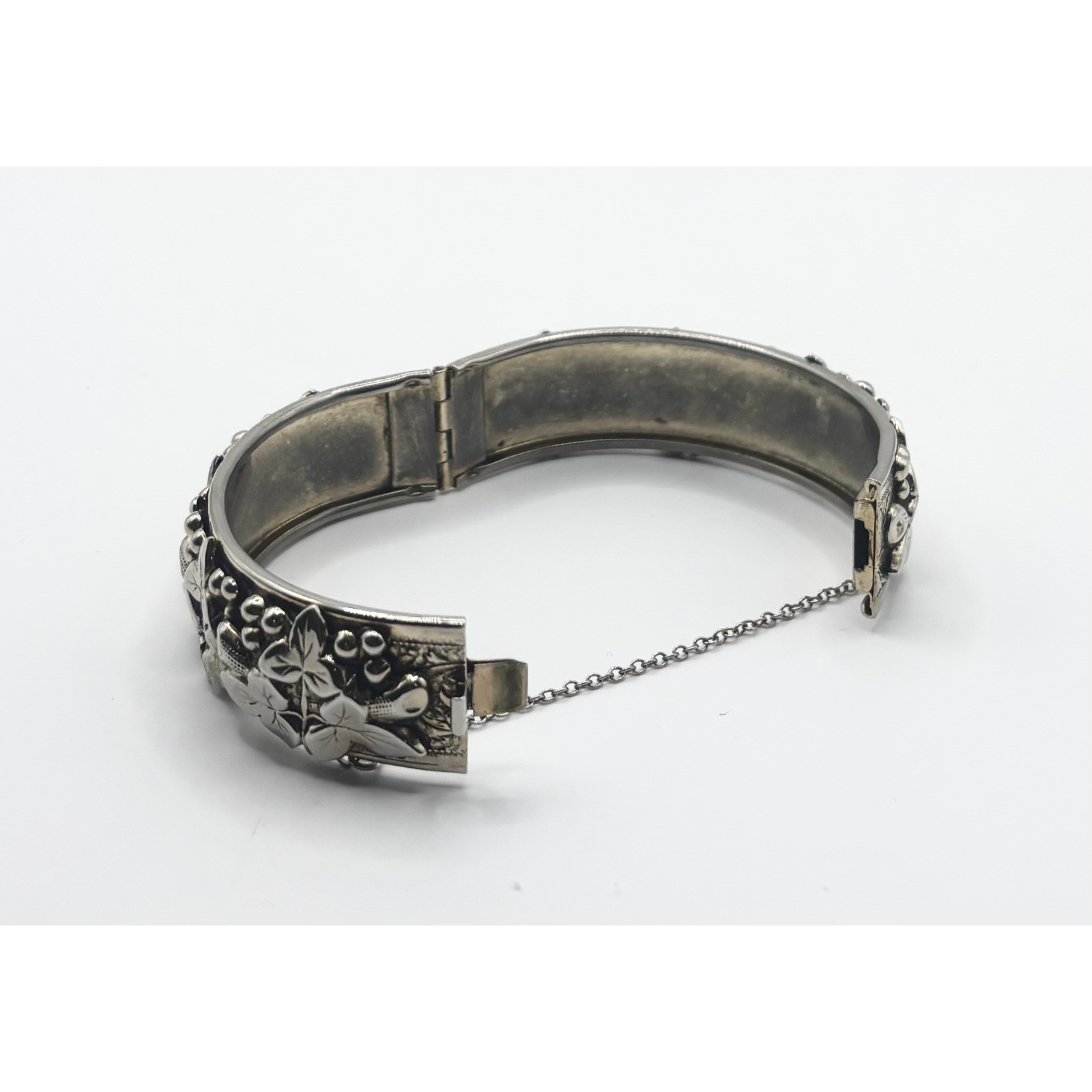 Vintage Silver Tone Embossed Floral Hinged Bangle Bracelet with Safety Chain