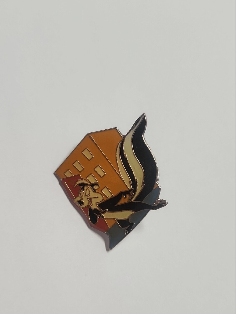 Pepe Le Pew 1998 Cartoon Skunk Pin in Black, Cream & Orange