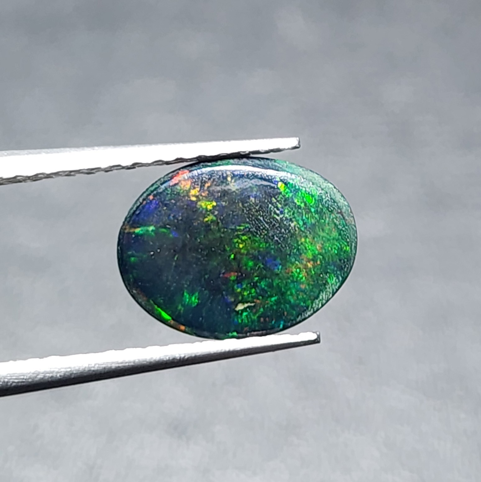 Natural Welo Black Opal Ethiopia Oval Cabochon Vivid Green Fire Gemstone 1.20Ct