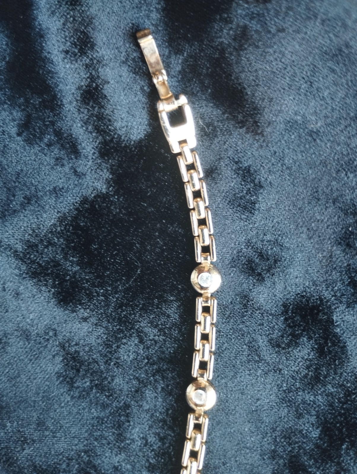 Gold-colored bracelet.