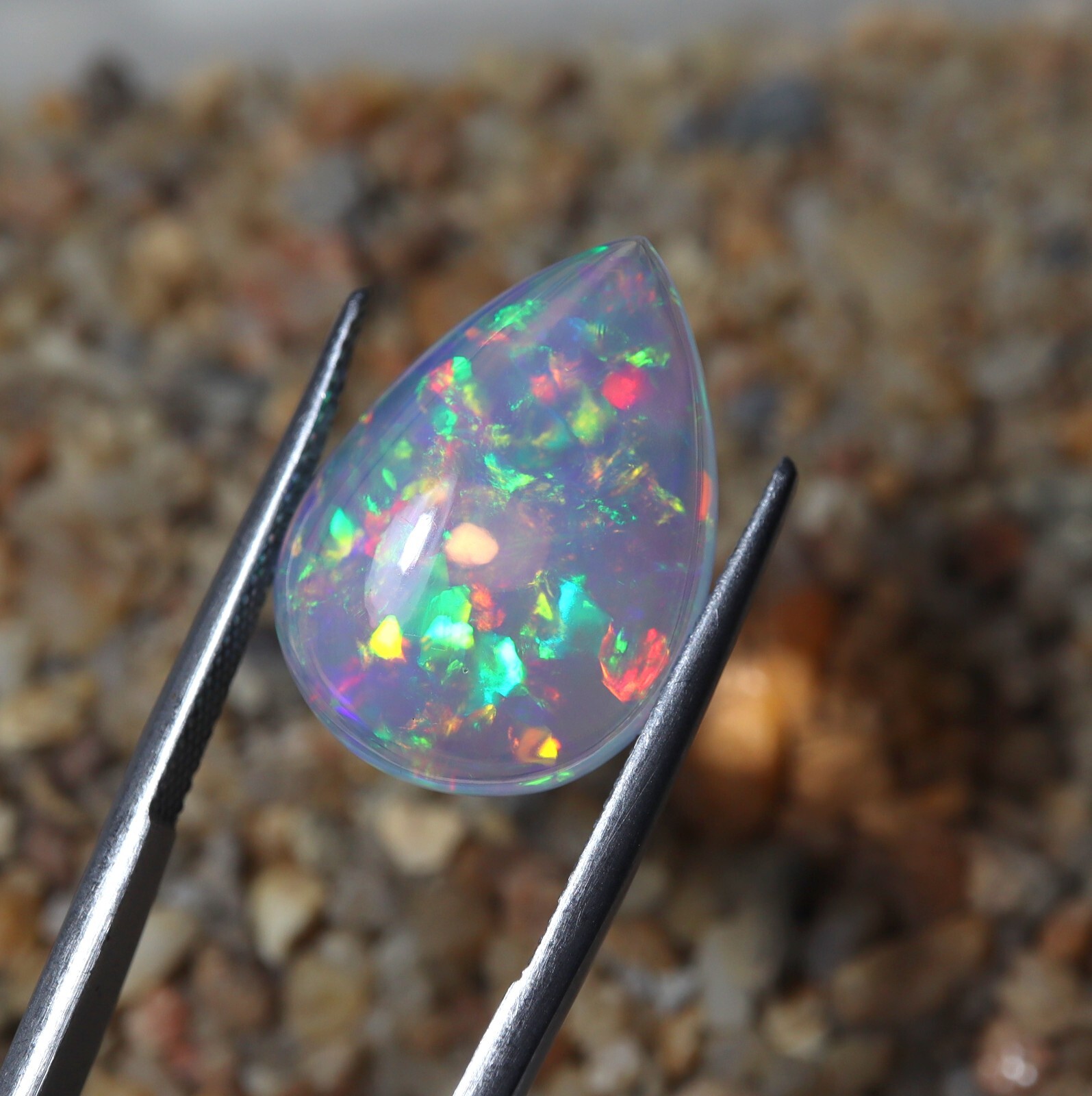 9 Carat 21.9×15.9 MM Natural AAAA Rainbow Fire Ethiopian Welo Opal Pear Shape
