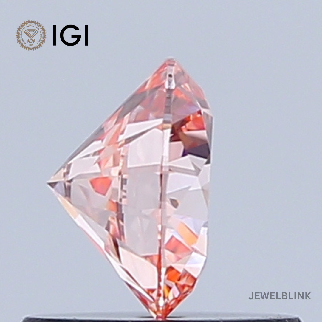 IGI Certified 0.66 CT VS1 Fancy Vivid Orangy Pink Round Cut Lab Grown Diamond