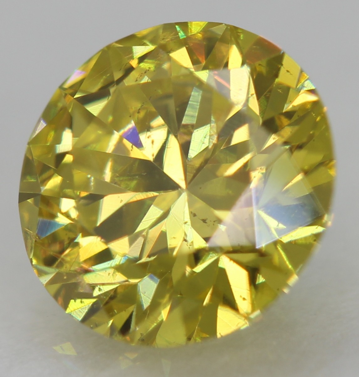 Cert 0.57 Carat Canary Yellow VVS2 Round Brilliant Natural Enhanced Diamond 5.5m