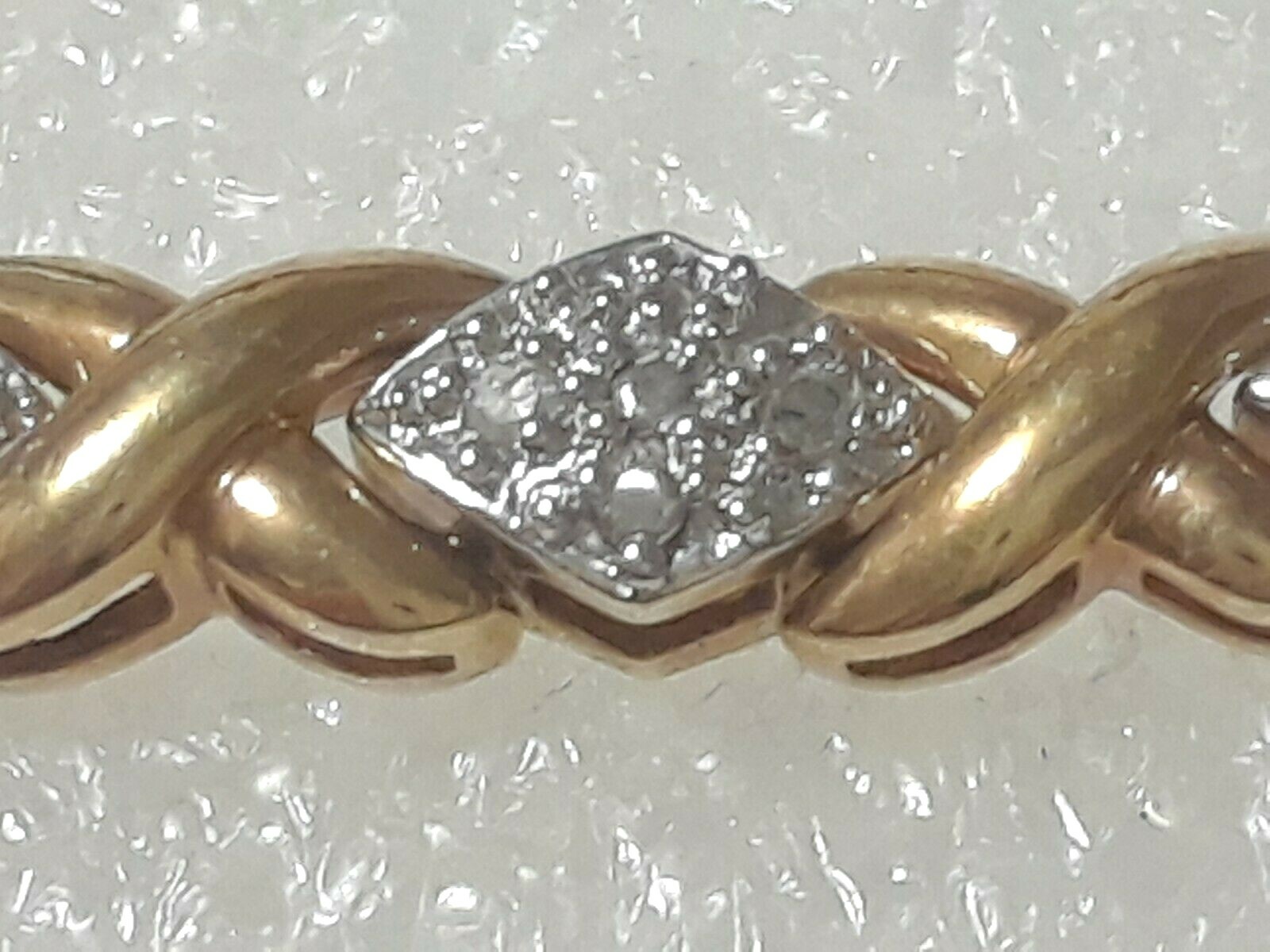 Gold tone bracelet with clear stones and safety lock clasp. 7″ long. Beautiful!