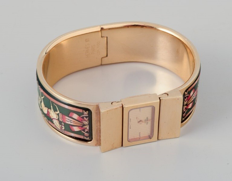 Hermes, ladies’ wristwatch. Made of gilded metal and enamel work.
