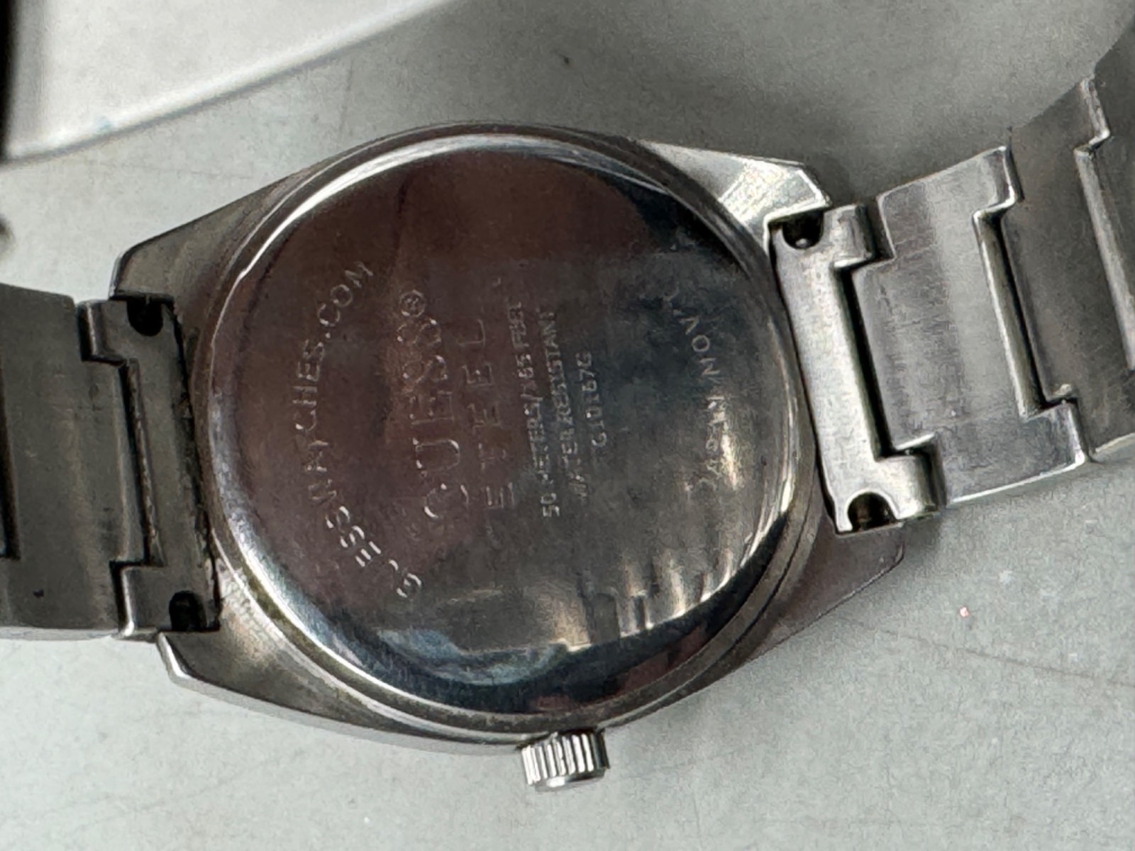 guess steel men’s watch 50 meters 165 feet water resistant made in Japan READ