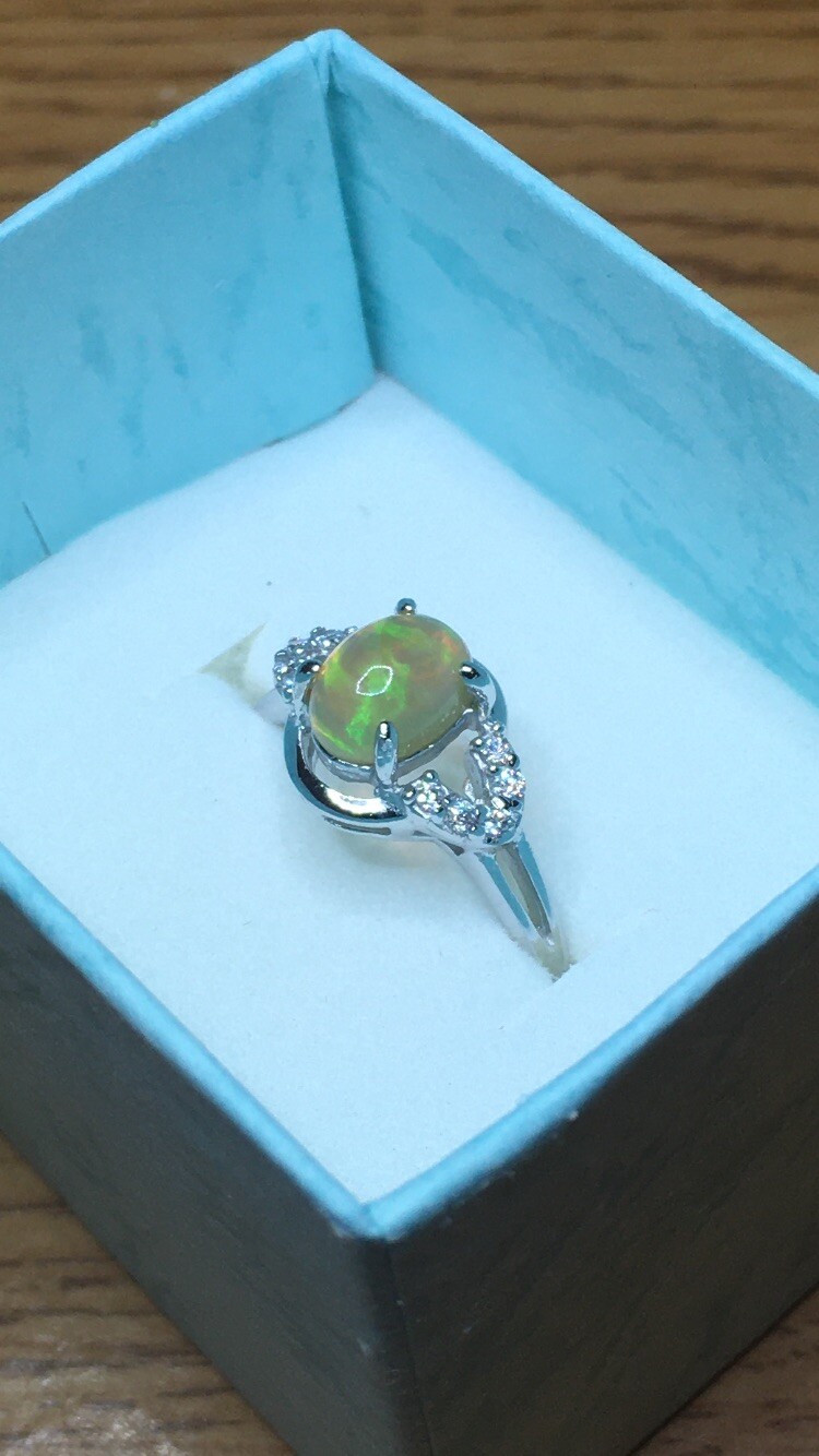 #138B- 0.95ct Genuine Ethiopian Welo Opal set in a Size 8.5 Sterling Silver Ring