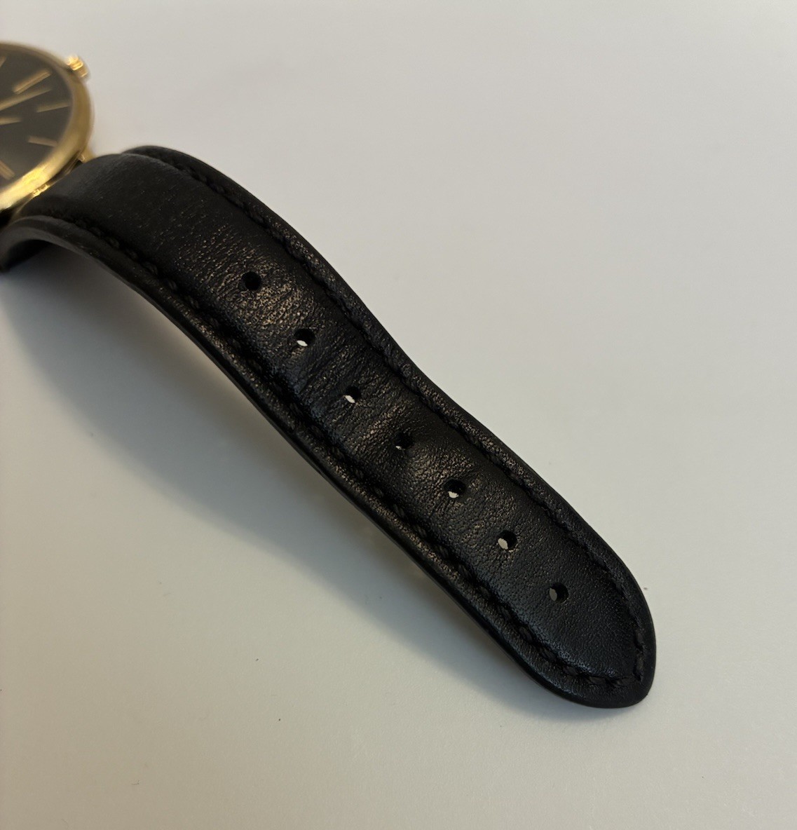 Movado Ultra Slim Women’s Black Dial Leather Strap Quartz Watch – 0607091