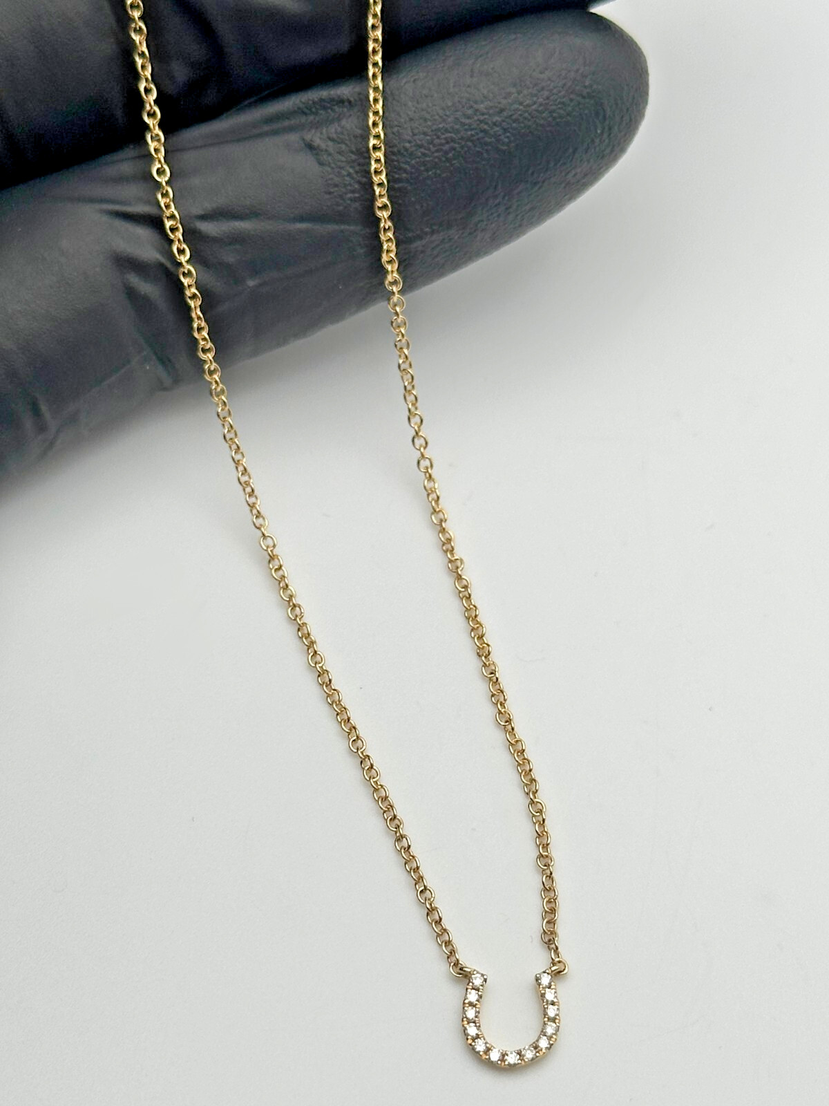 14k Gold 18″ Necklace, Horseshoe center piece set with 0.08cts of Diamonds 2g