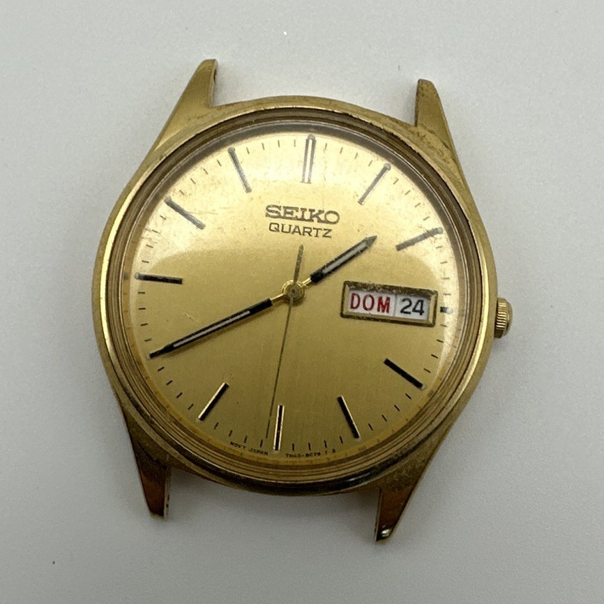 Seiko Quartz Men’s Gold Sunburst Dial Stick Indices Day/Date Watch