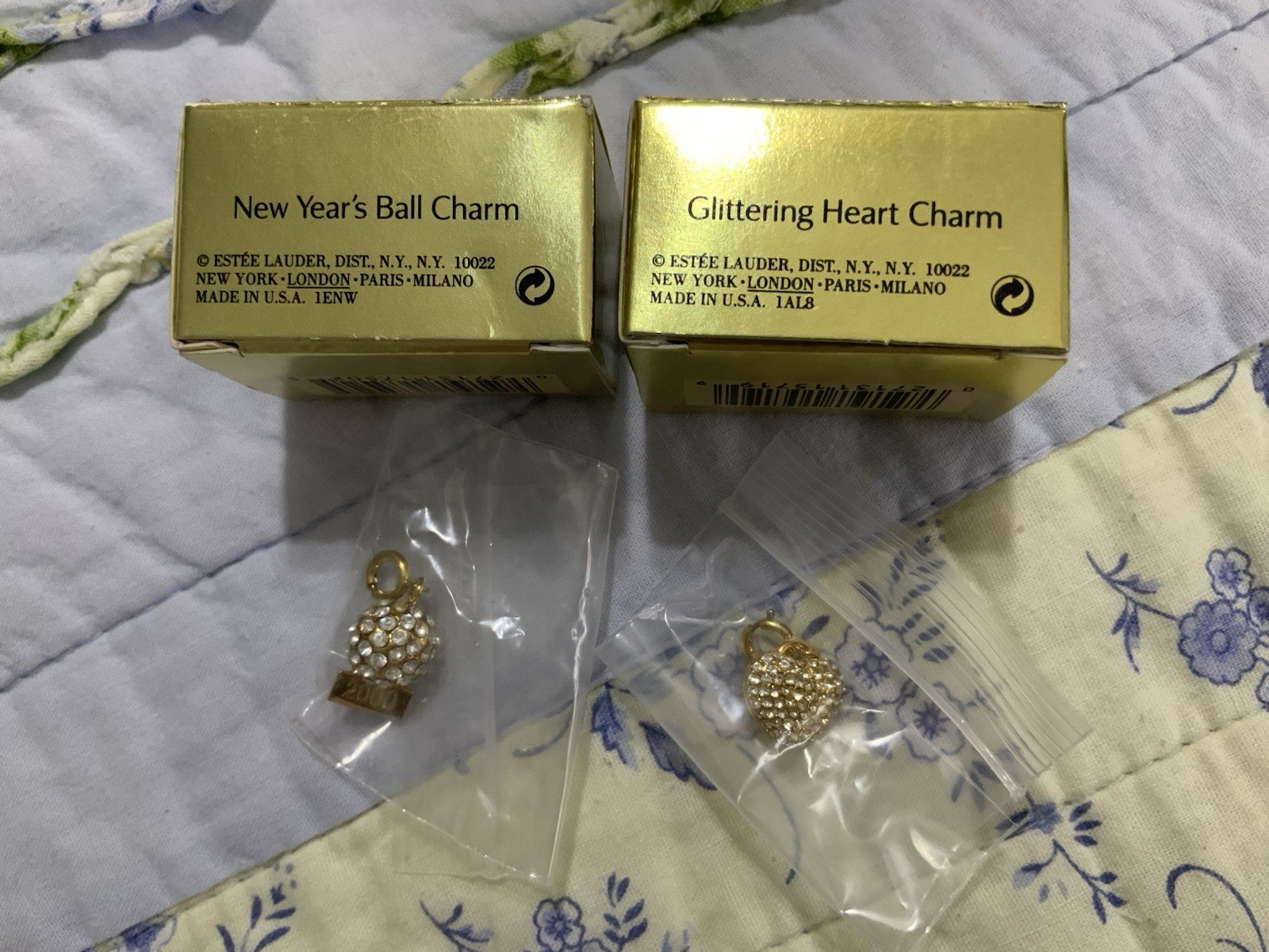 TWO Estee Lauder Charms Gold Tone NIB (Glittering Heart + New Year’s Ball)