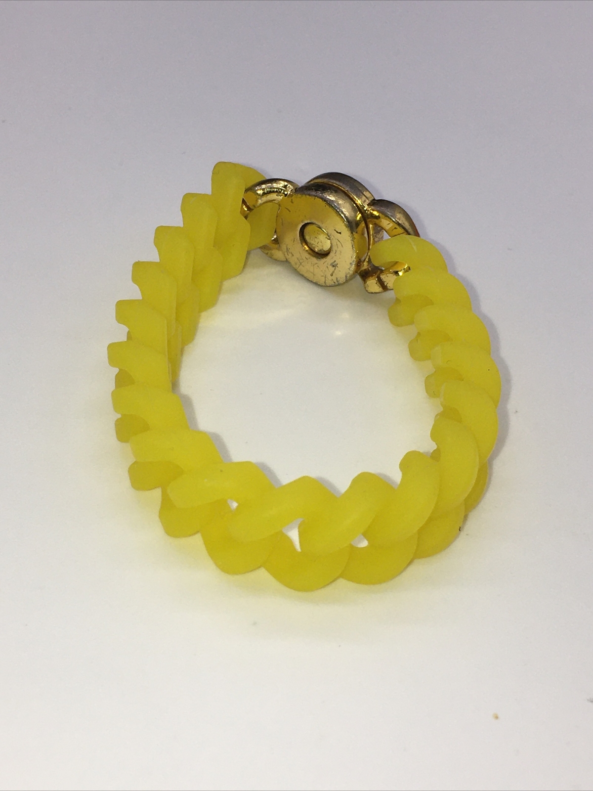 Rustic Cuff Gold Tone Logo Turn Lock Yellow Silicone Stretch Bracelet