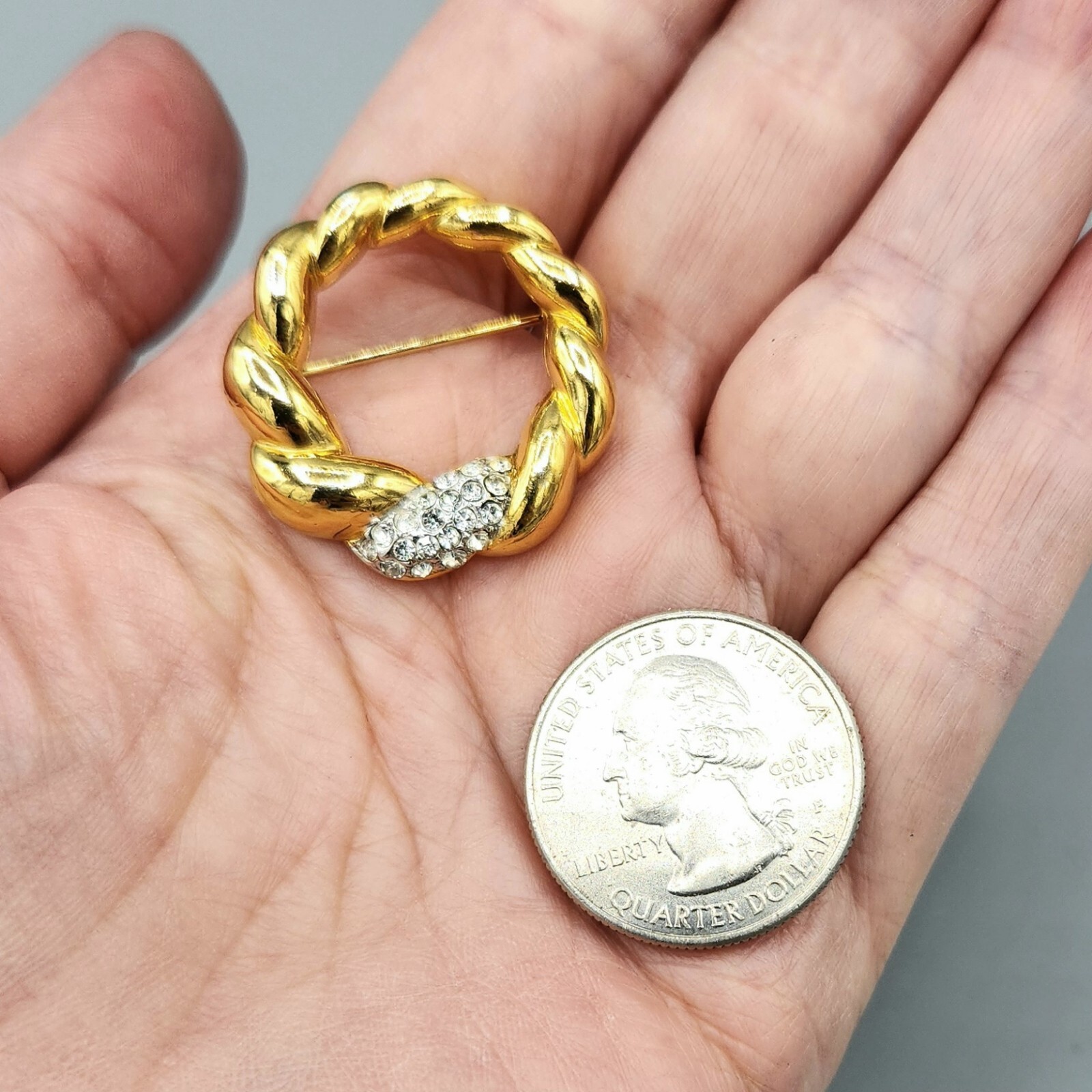Crown Trifari Polished Gold Tone Crystal Pave Open Circle Twist Brooch