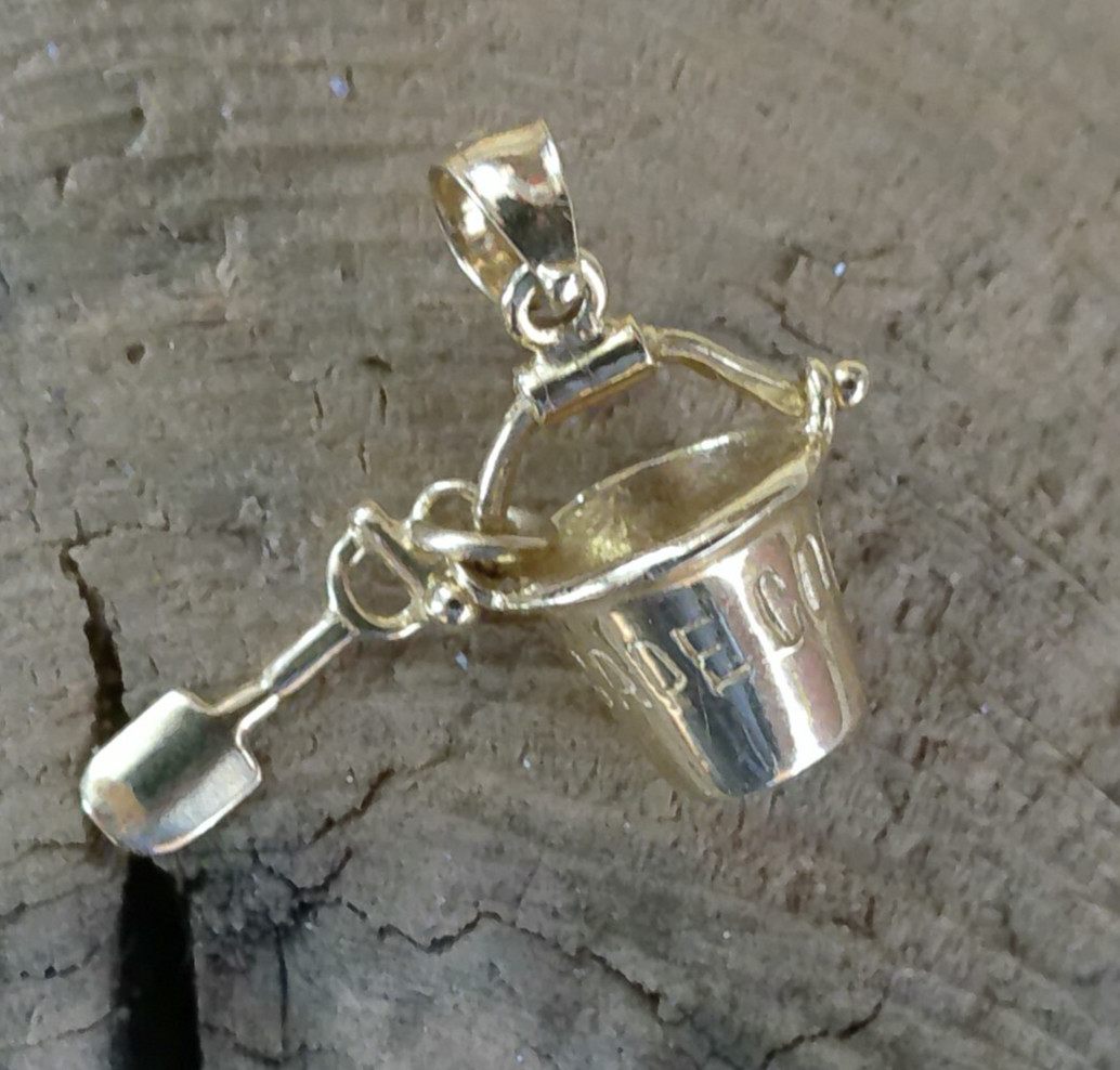 marked 14K GOLD CHARM CAPE COD PAIL & SHOVEL SAILBOAT ON BACK SIDE 2.4 GRAMS