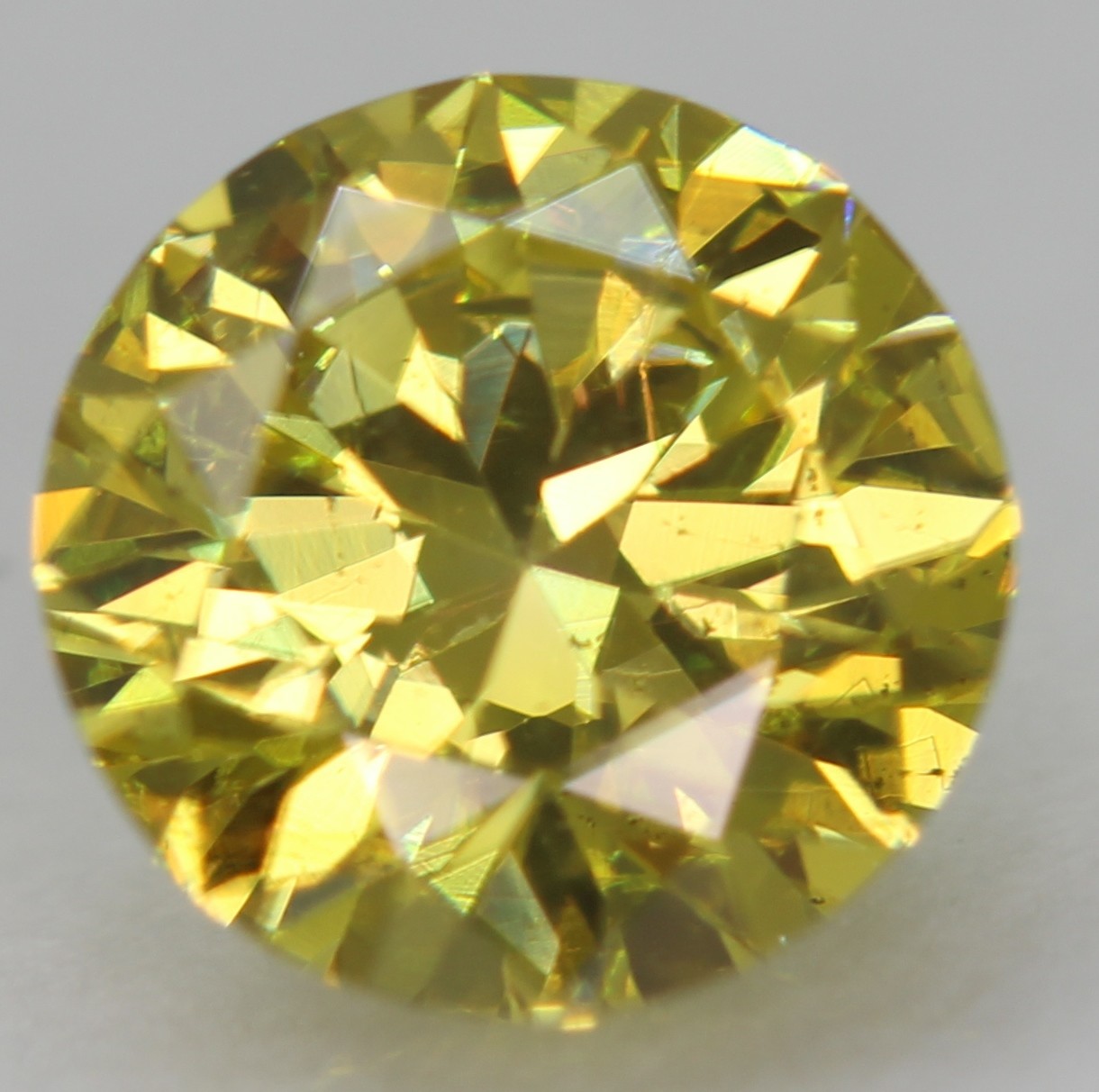 Cert 0.57 Carat Canary Yellow VVS2 Round Brilliant Natural Enhanced Diamond 5.5m