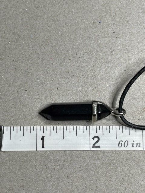 Black Tourmaline Pendant hanging from a 16″ Leather Cord with a 2′ extender