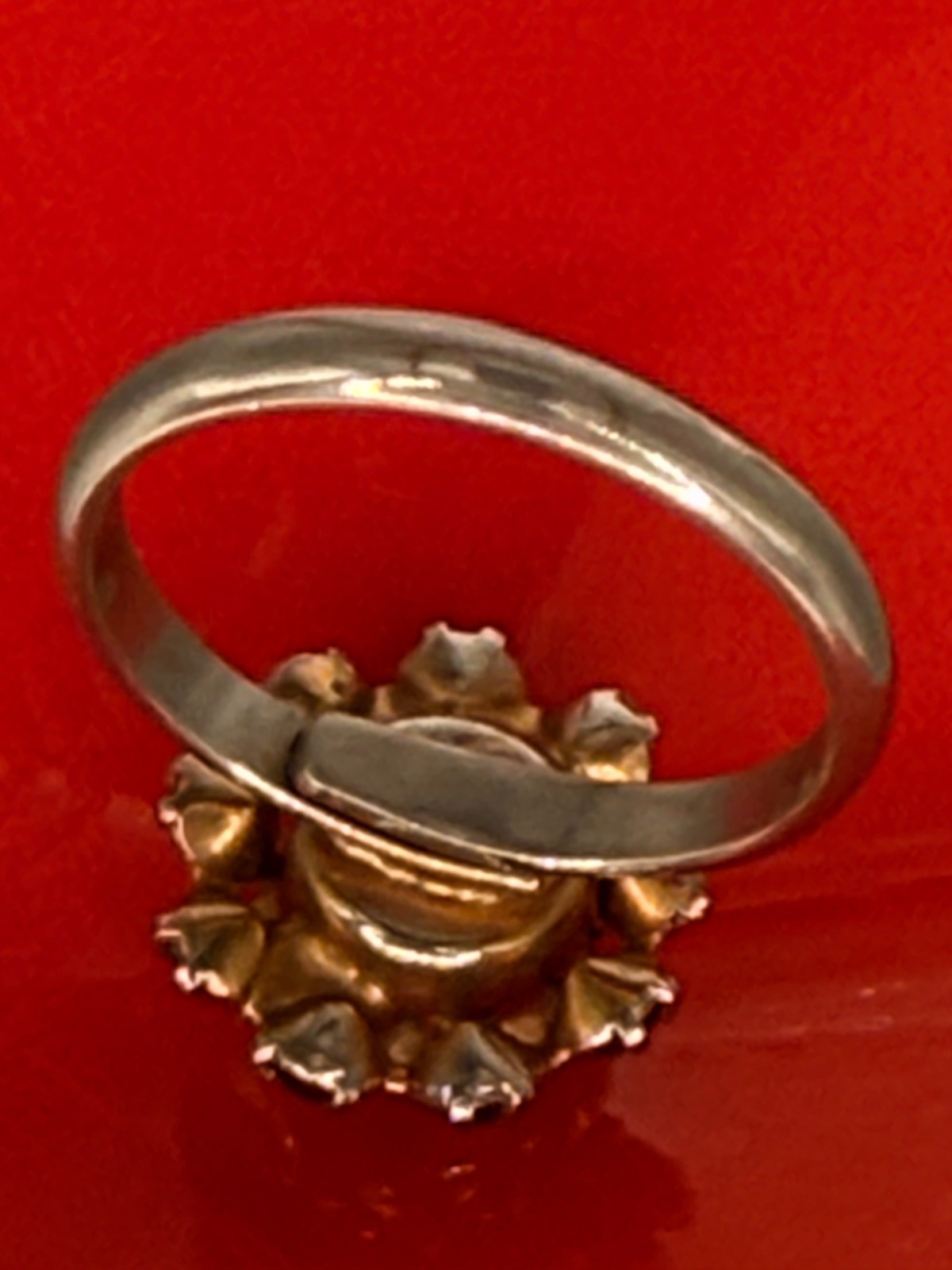 Deep Burgundy ring features a cluster of red rhinestones in a gold-tone setting.